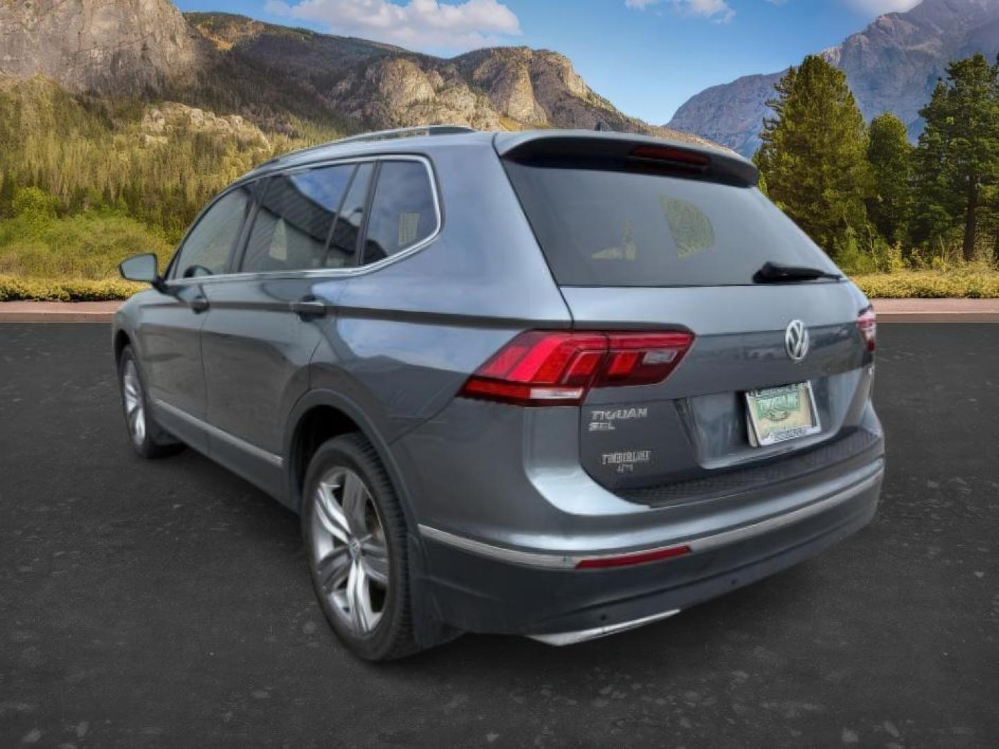 2021 GRAY /Titan Black Volkswagen Tiguan (3VV2B7AX1MM) with an 2L I-4 gasoline direct injection engine, Automatic transmission, located at 1175 N Woodruff Ave, Idaho Falls, ID, 83401, 43.506901, -111.999657 - At Timberline Auto, finding a great deal on your next vehicle is always easy! Our experienced sales staff's goal is to help find you the right vehicle at the right price! Our knowledgeable finance department has options for almost any credit score. We offer extended service contract options to prote - Photo#2