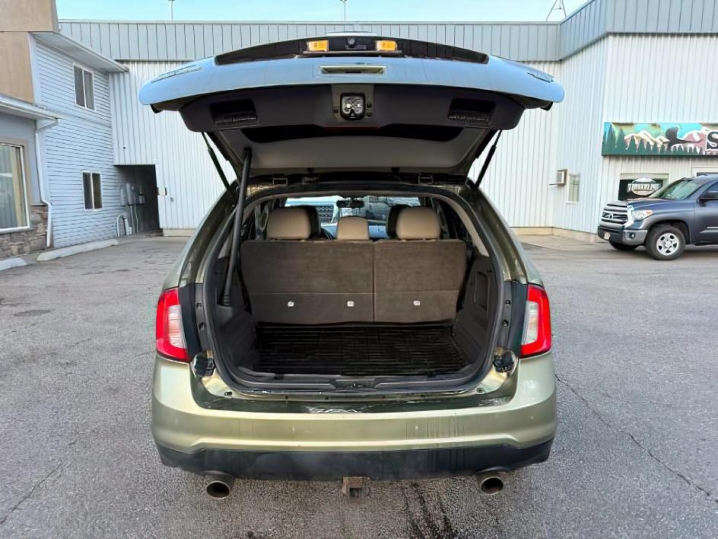 2013 GREEN /Charcoal Black Ford Edge (2FMDK4JC6DB) with an 35L V-6 DOHC engine, Automatic transmission, located at 1175 N Woodruff Ave, Idaho Falls, ID, 83401, 43.506901, -111.999657 - At Timberline Auto, finding a great deal on your next vehicle is always easy! Our experienced sales staff's goal is to help find you the right vehicle at the right price! Our knowledgeable finance department has options for almost any credit score. We offer extended service contract options to prote - Photo#5