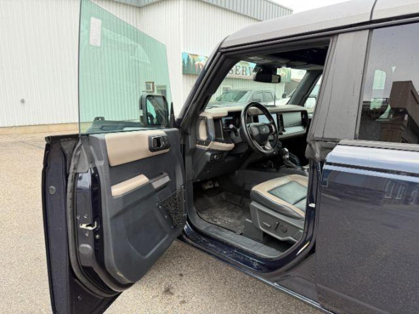 2021 BLUE /Medium Sandstone w/Black Onyx Ford Bronco (1FMEE5DP7ML) with an EcoBoost 27L V-6 portdirect injection engine, Automatic transmission, located at 1175 N Woodruff Ave, Idaho Falls, ID, 83401, 43.506901, -111.999657 - At Timberline Auto, finding a great deal on your next vehicle is always easy! Our experienced sales staff's goal is to help find you the right vehicle at the right price! Our knowledgeable finance department has options for almost any credit score. We offer extended service contract options to prote - Photo#12