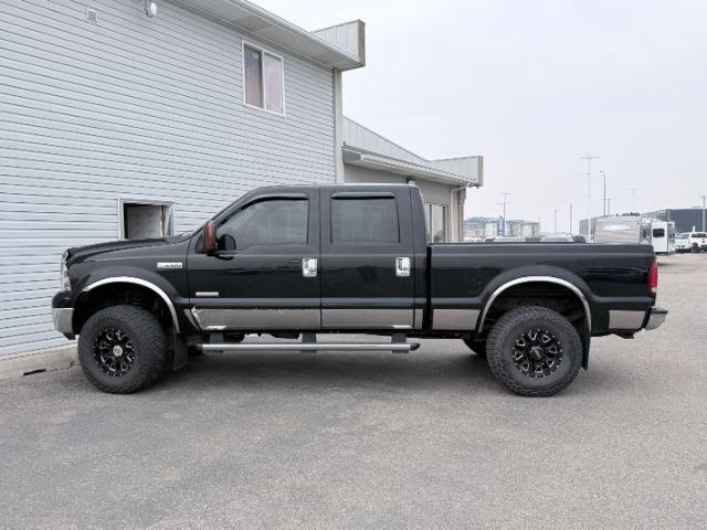 2005 Black Clearcoat /Medium Flint Ford F-350 LARIAT (1FTWW31P15E) with an Powerstroke 6L V-8 diesel direct injection | Trito engine, AUTOMATIC transmission, located at 1235 N Woodruff Ave., Idaho Falls, 83401, (208) 523-1053, 43.507172, -112.000488 - At Timberline Auto, finding a great deal on your next vehicle is always easy! Our experienced sales staff goal is to help find you the right vehicle at the right price! Our knowledgeable finance department has options for almost any credit score. We offer extended service contract options to prot- Photo#1