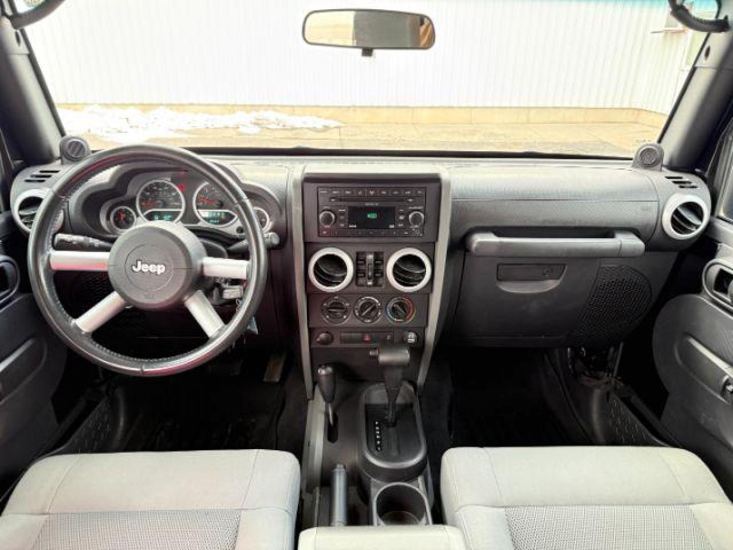 2008 BLACK /Dark Slate Gray/Med Slate Gray Jeep Wrangler (1J4GA59148L) with an 38L V-6 regular unleaded engine, Automatic transmission, located at 1175 N Woodruff Ave, Idaho Falls, ID, 83401, 43.506901, -111.999657 - At Timberline Auto, finding a great deal on your next vehicle is always easy! Our experienced sales staff's goal is to help find you the right vehicle at the right price! Our knowledgeable finance department has options for almost any credit score. We offer extended service contract options to prote - Photo#39