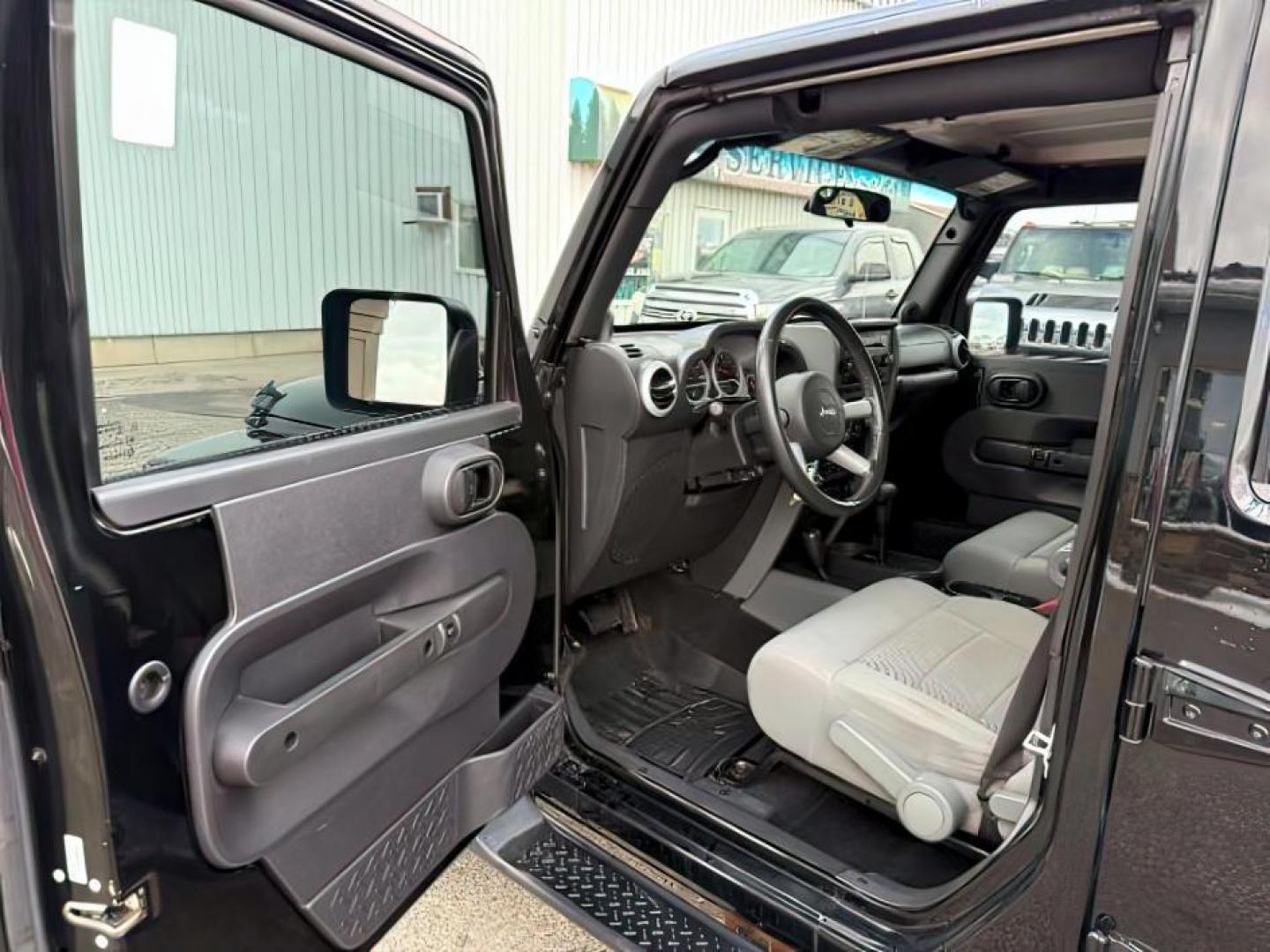 2008 BLACK /Dark Slate Gray/Med Slate Gray Jeep Wrangler (1J4GA59148L) with an 38L V-6 regular unleaded engine, Automatic transmission, located at 1175 N Woodruff Ave, Idaho Falls, ID, 83401, 43.506901, -111.999657 - At Timberline Auto, finding a great deal on your next vehicle is always easy! Our experienced sales staff's goal is to help find you the right vehicle at the right price! Our knowledgeable finance department has options for almost any credit score. We offer extended service contract options to prote - Photo#11