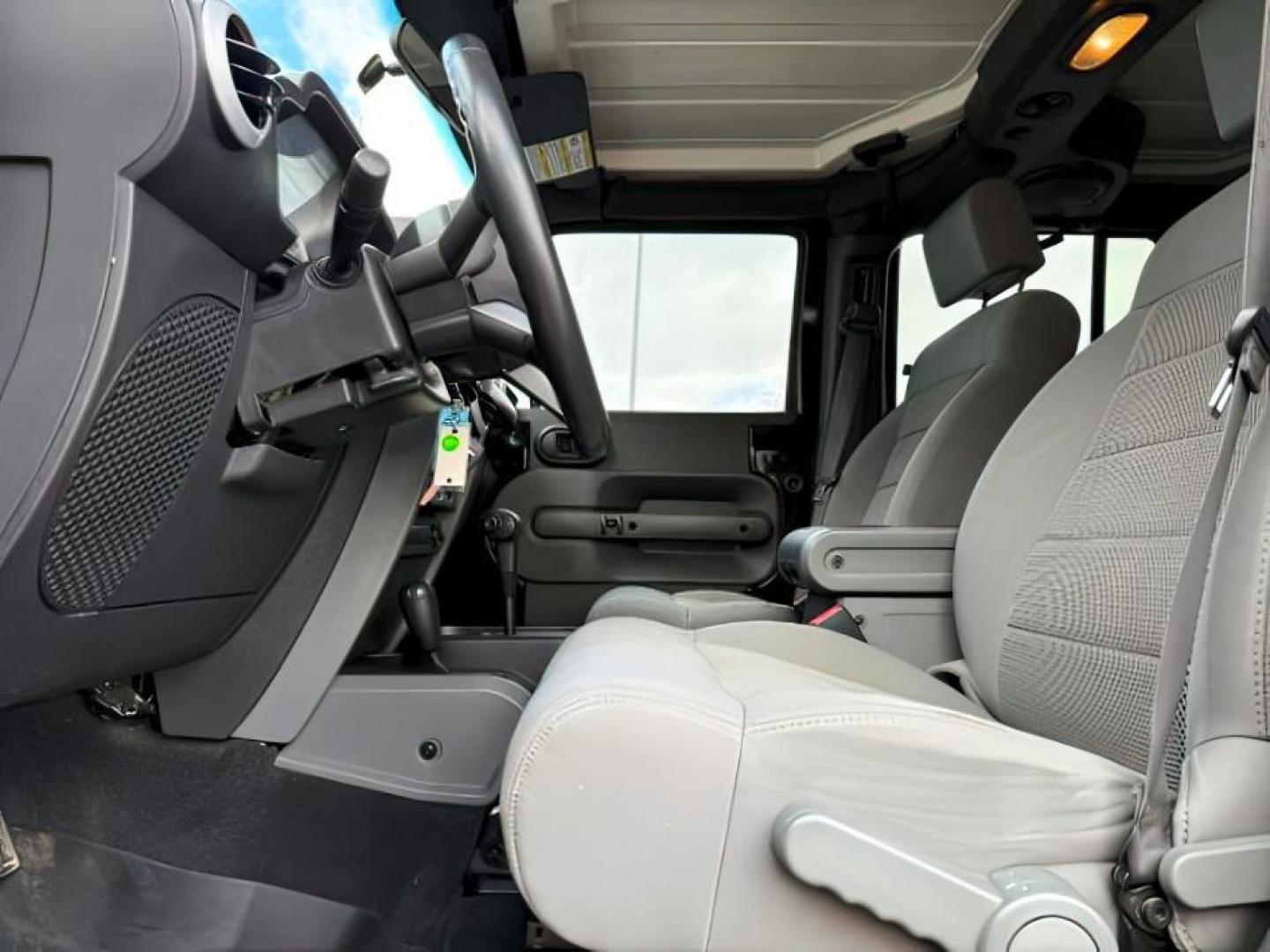 2008 BLACK /Dark Slate Gray/Med Slate Gray Jeep Wrangler (1J4GA59148L) with an 38L V-6 regular unleaded engine, Automatic transmission, located at 1175 N Woodruff Ave, Idaho Falls, ID, 83401, 43.506901, -111.999657 - At Timberline Auto, finding a great deal on your next vehicle is always easy! Our experienced sales staff's goal is to help find you the right vehicle at the right price! Our knowledgeable finance department has options for almost any credit score. We offer extended service contract options to prote - Photo#12