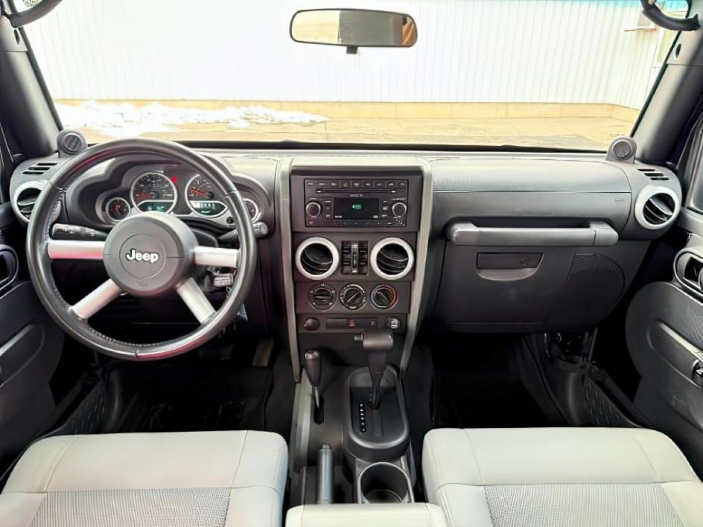 2008 BLACK /Dark Slate Gray/Med Slate Gray Jeep Wrangler (1J4GA59148L) with an 38L V-6 regular unleaded engine, Automatic transmission, located at 1175 N Woodruff Ave, Idaho Falls, ID, 83401, 43.506901, -111.999657 - At Timberline Auto, finding a great deal on your next vehicle is always easy! Our experienced sales staff's goal is to help find you the right vehicle at the right price! Our knowledgeable finance department has options for almost any credit score. We offer extended service contract options to prote - Photo#18