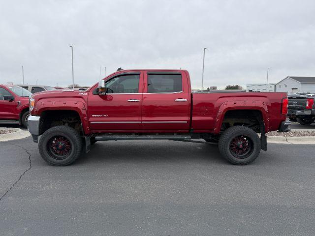 2018 RED /Jet Black GMC Sierra 3500HD SLT (1GT42XCY4JF) with an Duramax 6.6L V-8 diesel direct injection engine, AUTOMATIC transmission, located at 1235 N Woodruff Ave., Idaho Falls, 83401, (208) 523-1053, 43.507172, -112.000488 - At Timberline Auto, finding a great deal on your next vehicle is always easy! Our experienced sales staff's goal is to help find you the right vehicle at the right price! Our knowledgeable finance department has options for almost any credit score. We offer extended service contract options to prote - Photo#1