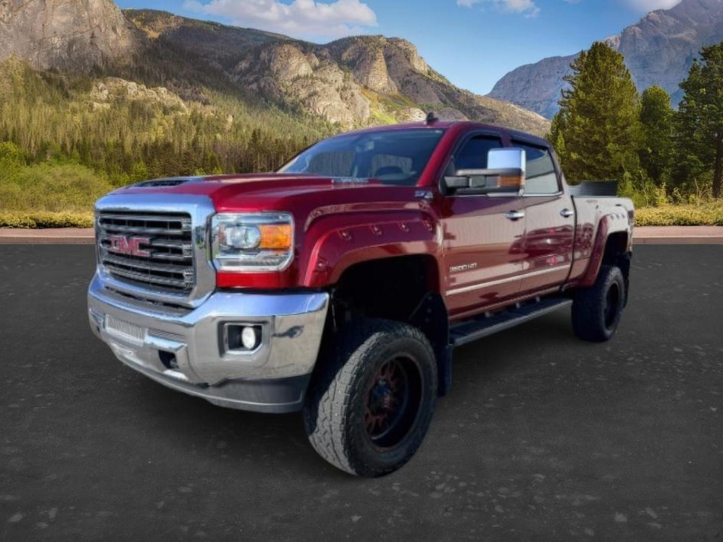 2018 RED /Jet Black GMC Sierra 3500HD (1GT42XCY4JF) with an Duramax 66L V-8 diesel direct injection engine, Automatic transmission, located at 1175 N Woodruff Ave, Idaho Falls, ID, 83401, 43.506901, -111.999657 - Heavy duty diesel strength and modern everyday convenience come together in this 2018 GMC Sierra 3500HD Crew Cab 4x4 equipped with the 6.6L Duramax turbo diesel engine. Built for serious towing and hauling, this 3500HD delivers the capability needed for trailers, equipment, and demanding workloads w- Photo#0