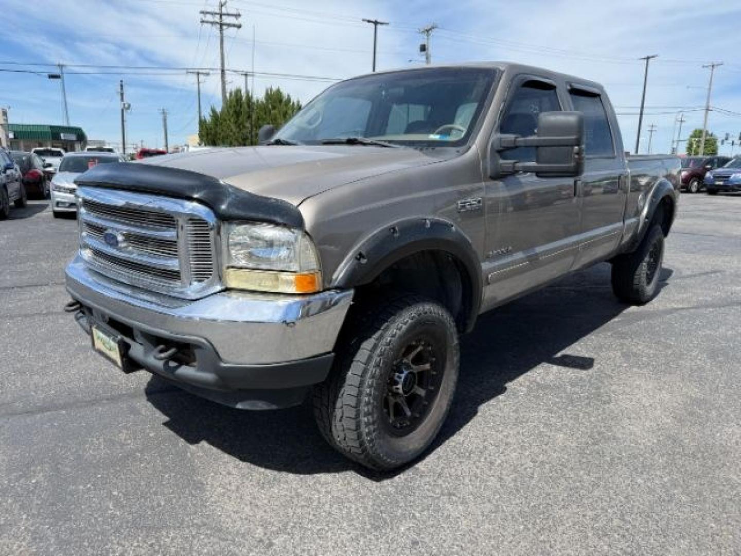2002 BROWN /LEATHER Ford Super Duty F-250 (1FTNW21F02E) with an 73L V8 engine, Automatic transmission, located at 1175 N Woodruff Ave, Idaho Falls, ID, 83401, 43.506901, -111.999657 - This 2002 Ford F-250 Super Duty is a heavy-duty pickup built for serious work and strong diesel performance. Powered by the legendary 7.3L Power Stroke diesel, it delivers the low-end torque and hauling capability these trucks are known for. It comes lifted and sits on XD wheels, giving it an aggres- Photo#25