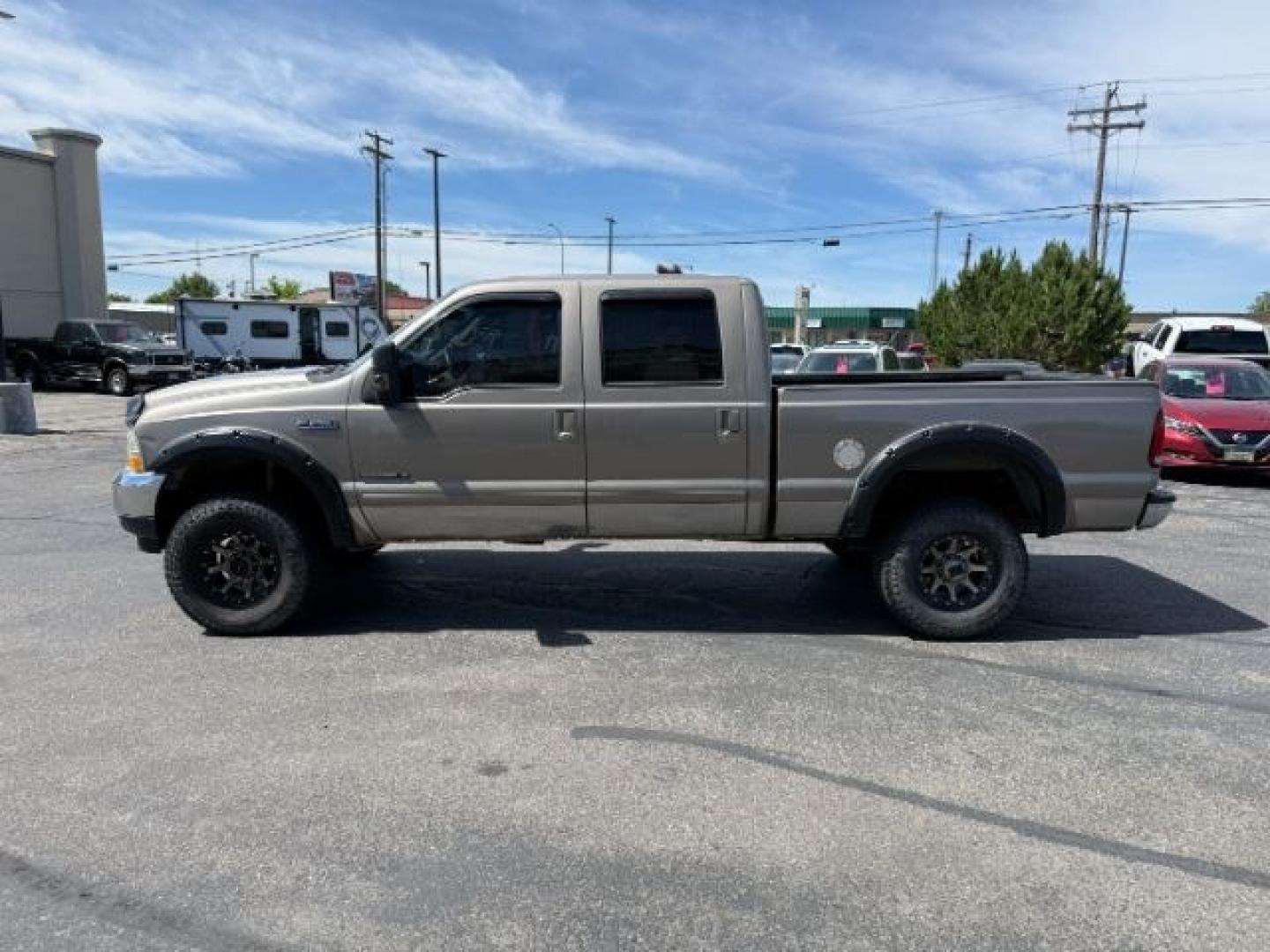 2002 BROWN /LEATHER Ford Super Duty F-250 (1FTNW21F02E) with an 73L V8 engine, Automatic transmission, located at 1175 N Woodruff Ave, Idaho Falls, ID, 83401, 43.506901, -111.999657 - This 2002 Ford F-250 Super Duty is a heavy-duty pickup built for serious work and strong diesel performance. Powered by the legendary 7.3L Power Stroke diesel, it delivers the low-end torque and hauling capability these trucks are known for. It comes lifted and sits on XD wheels, giving it an aggres- Photo#26