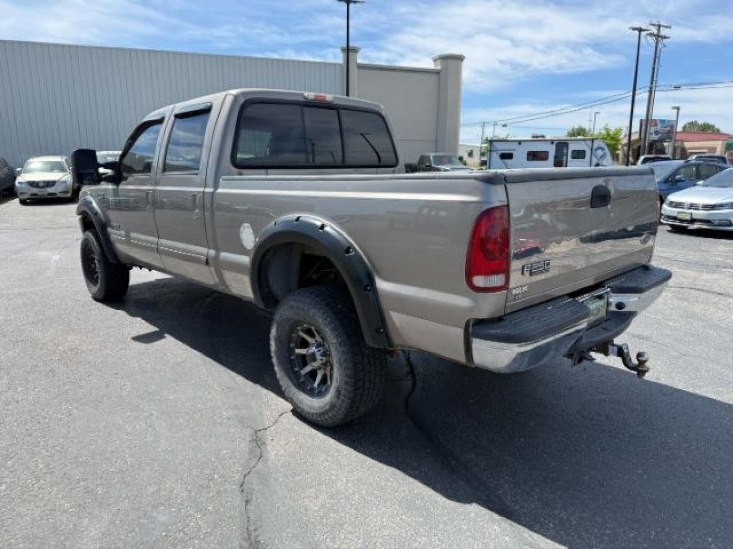 2002 BROWN /LEATHER Ford Super Duty F-250 (1FTNW21F02E) with an 73L V8 engine, Automatic transmission, located at 1175 N Woodruff Ave, Idaho Falls, ID, 83401, 43.506901, -111.999657 - This 2002 Ford F-250 Super Duty is a heavy-duty pickup built for serious work and strong diesel performance. Powered by the legendary 7.3L Power Stroke diesel, it delivers the low-end torque and hauling capability these trucks are known for. It comes lifted and sits on XD wheels, giving it an aggres- Photo#27
