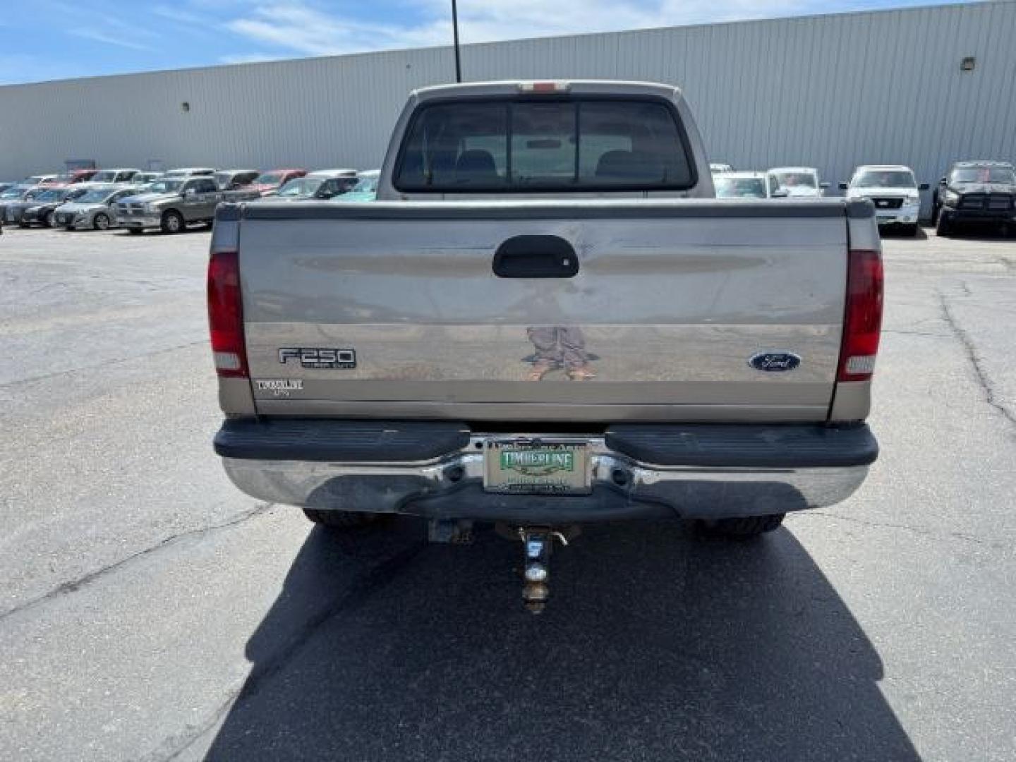 2002 BROWN /LEATHER Ford Super Duty F-250 (1FTNW21F02E) with an 73L V8 engine, Automatic transmission, located at 1175 N Woodruff Ave, Idaho Falls, ID, 83401, 43.506901, -111.999657 - This 2002 Ford F-250 Super Duty is a heavy-duty pickup built for serious work and strong diesel performance. Powered by the legendary 7.3L Power Stroke diesel, it delivers the low-end torque and hauling capability these trucks are known for. It comes lifted and sits on XD wheels, giving it an aggres- Photo#28