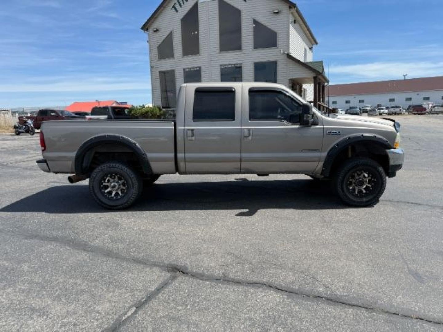 2002 BROWN /LEATHER Ford Super Duty F-250 (1FTNW21F02E) with an 73L V8 engine, Automatic transmission, located at 1175 N Woodruff Ave, Idaho Falls, ID, 83401, 43.506901, -111.999657 - This 2002 Ford F-250 Super Duty is a heavy-duty pickup built for serious work and strong diesel performance. Powered by the legendary 7.3L Power Stroke diesel, it delivers the low-end torque and hauling capability these trucks are known for. It comes lifted and sits on XD wheels, giving it an aggres- Photo#31