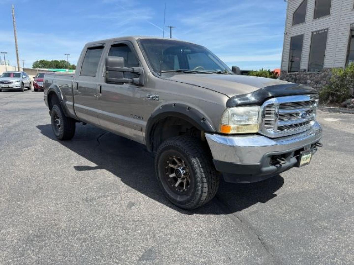 2002 BROWN /LEATHER Ford Super Duty F-250 (1FTNW21F02E) with an 73L V8 engine, Automatic transmission, located at 1175 N Woodruff Ave, Idaho Falls, ID, 83401, 43.506901, -111.999657 - This 2002 Ford F-250 Super Duty is a heavy-duty pickup built for serious work and strong diesel performance. Powered by the legendary 7.3L Power Stroke diesel, it delivers the low-end torque and hauling capability these trucks are known for. It comes lifted and sits on XD wheels, giving it an aggres- Photo#32