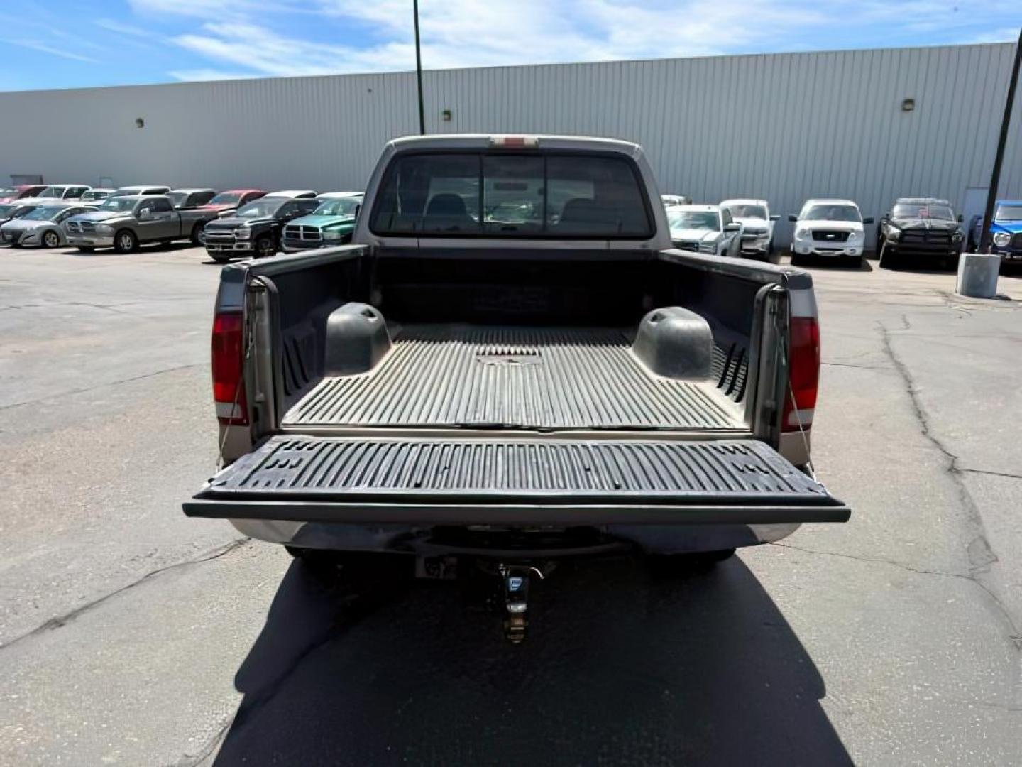 2002 BROWN /LEATHER Ford Super Duty F-250 (1FTNW21F02E) with an 73L V8 engine, Automatic transmission, located at 1175 N Woodruff Ave, Idaho Falls, ID, 83401, 43.506901, -111.999657 - This 2002 Ford F-250 Super Duty is a heavy-duty pickup built for serious work and strong diesel performance. Powered by the legendary 7.3L Power Stroke diesel, it delivers the low-end torque and hauling capability these trucks are known for. It comes lifted and sits on XD wheels, giving it an aggres- Photo#4