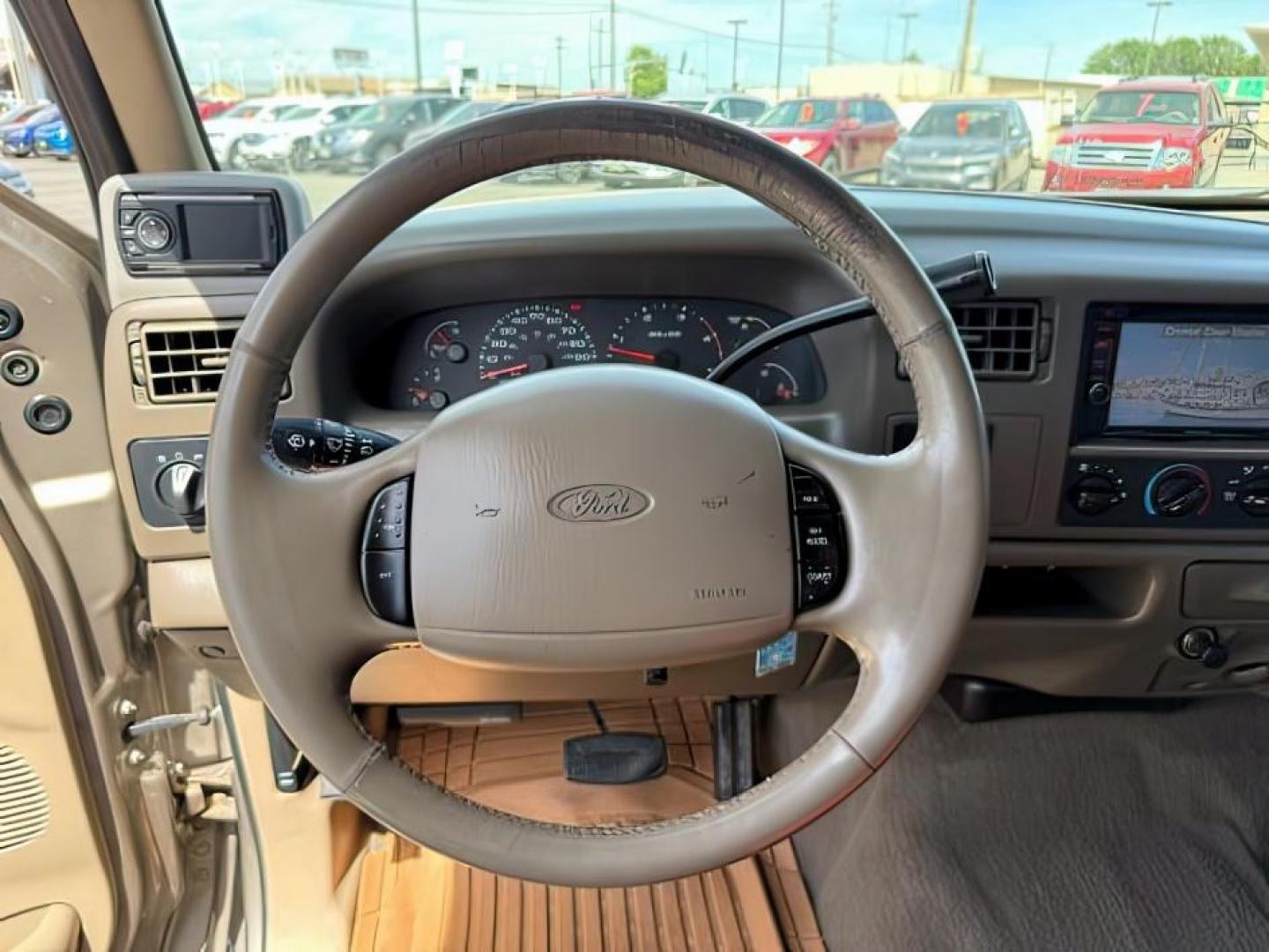 2002 BROWN /LEATHER Ford Super Duty F-250 (1FTNW21F02E) with an 73L V8 engine, Automatic transmission, located at 1175 N Woodruff Ave, Idaho Falls, ID, 83401, 43.506901, -111.999657 - This 2002 Ford F-250 Super Duty is a heavy-duty pickup built for serious work and strong diesel performance. Powered by the legendary 7.3L Power Stroke diesel, it delivers the low-end torque and hauling capability these trucks are known for. It comes lifted and sits on XD wheels, giving it an aggres- Photo#14