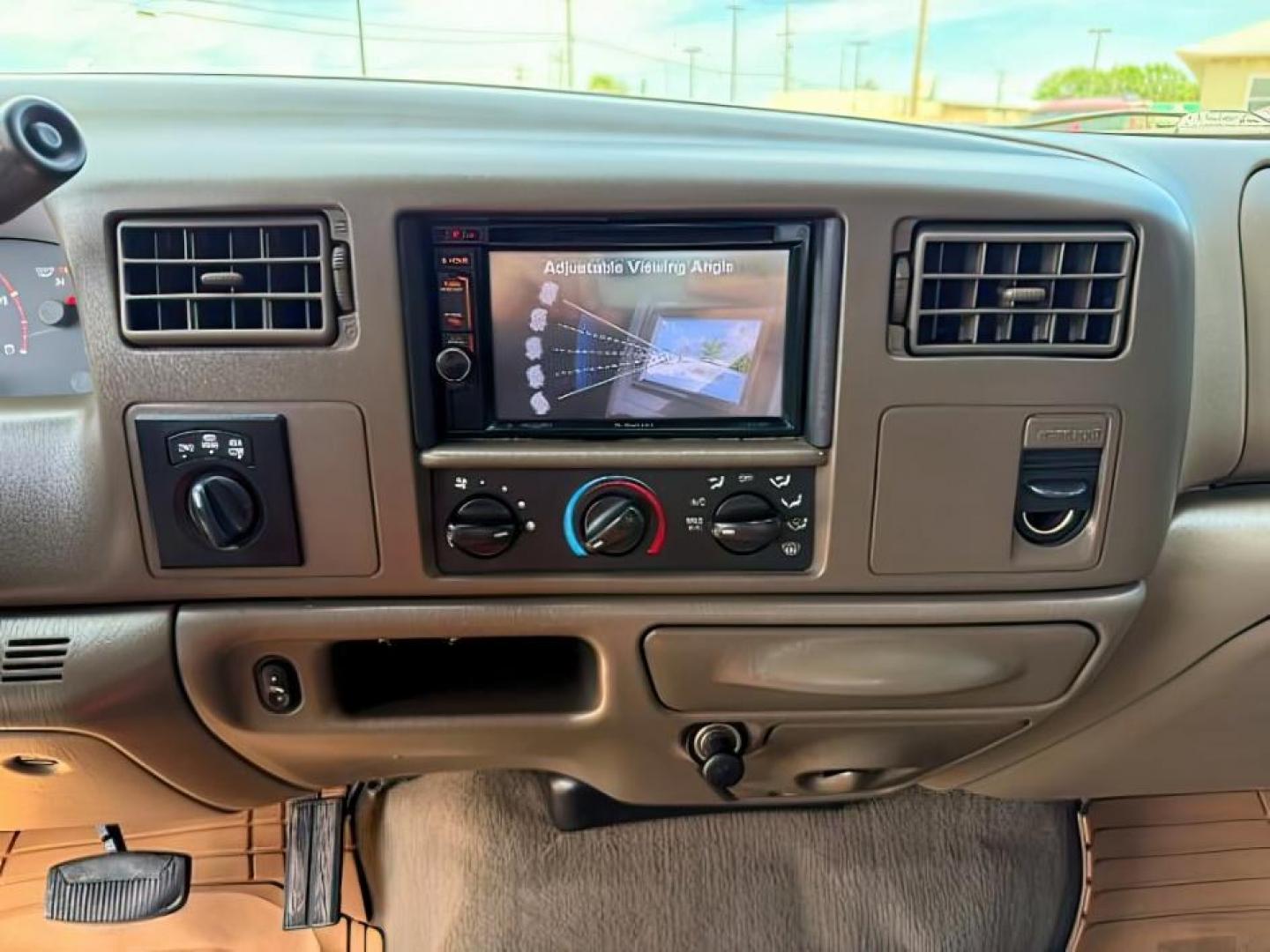 2002 BROWN /LEATHER Ford Super Duty F-250 (1FTNW21F02E) with an 73L V8 engine, Automatic transmission, located at 1175 N Woodruff Ave, Idaho Falls, ID, 83401, 43.506901, -111.999657 - This 2002 Ford F-250 Super Duty is a heavy-duty pickup built for serious work and strong diesel performance. Powered by the legendary 7.3L Power Stroke diesel, it delivers the low-end torque and hauling capability these trucks are known for. It comes lifted and sits on XD wheels, giving it an aggres- Photo#15
