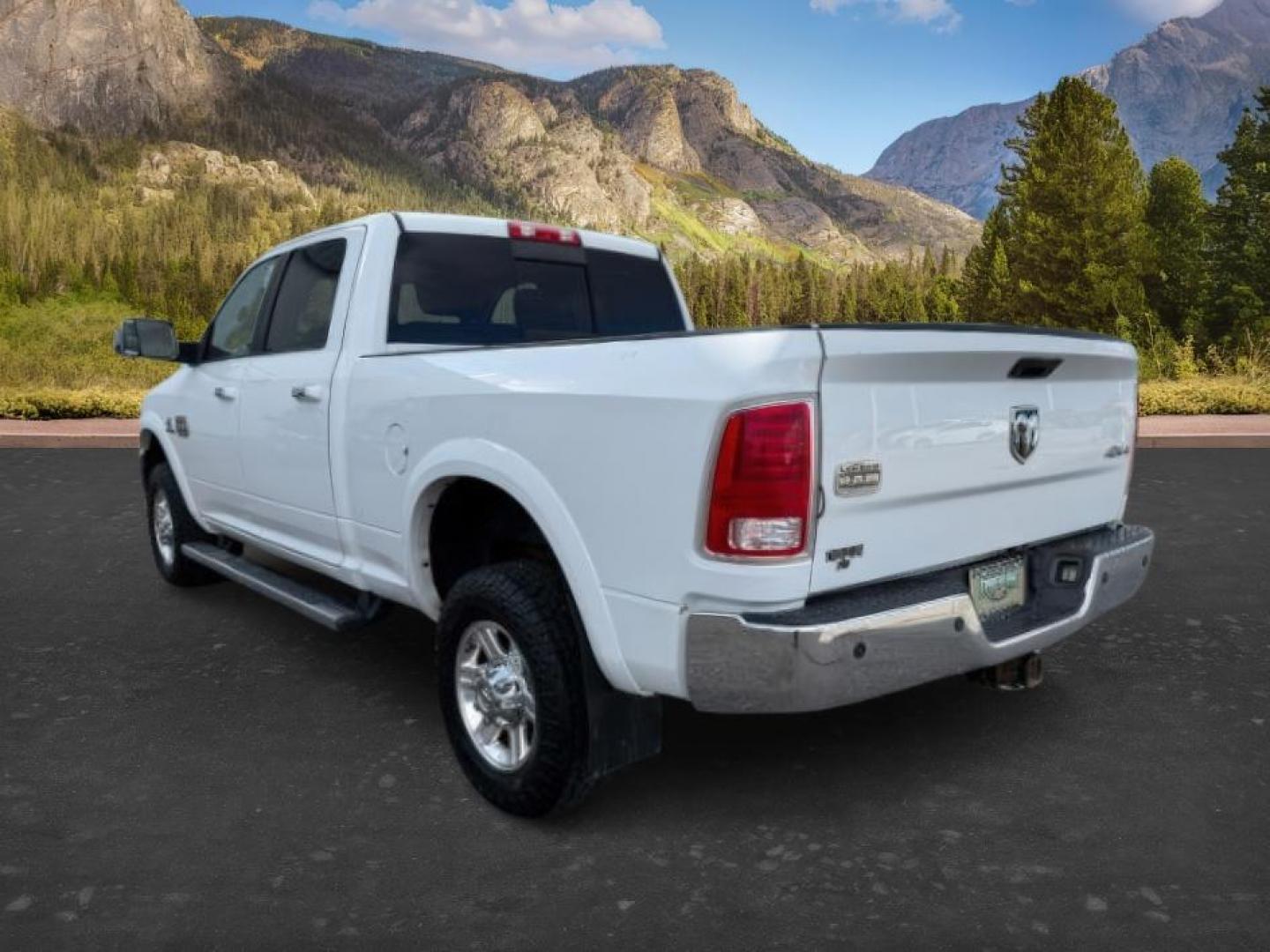 2013 Bright White Clearcoat /Light Frost Beige/Canyon Brown Ram 2500 (3C6UR5GL1DG) with an Cummins 67L I-6 diesel direct injection engine, Automatic transmission, located at 1175 N Woodruff Ave, Idaho Falls, ID, 83401, 43.506901, -111.999657 - At Timberline Auto, finding a great deal on your next vehicle is always easy! Our experienced sales staff's goal is to help find you the right vehicle at the right price! Our knowledgeable finance department has options for almost any credit score. We offer extended service contract options to prote - Photo#2
