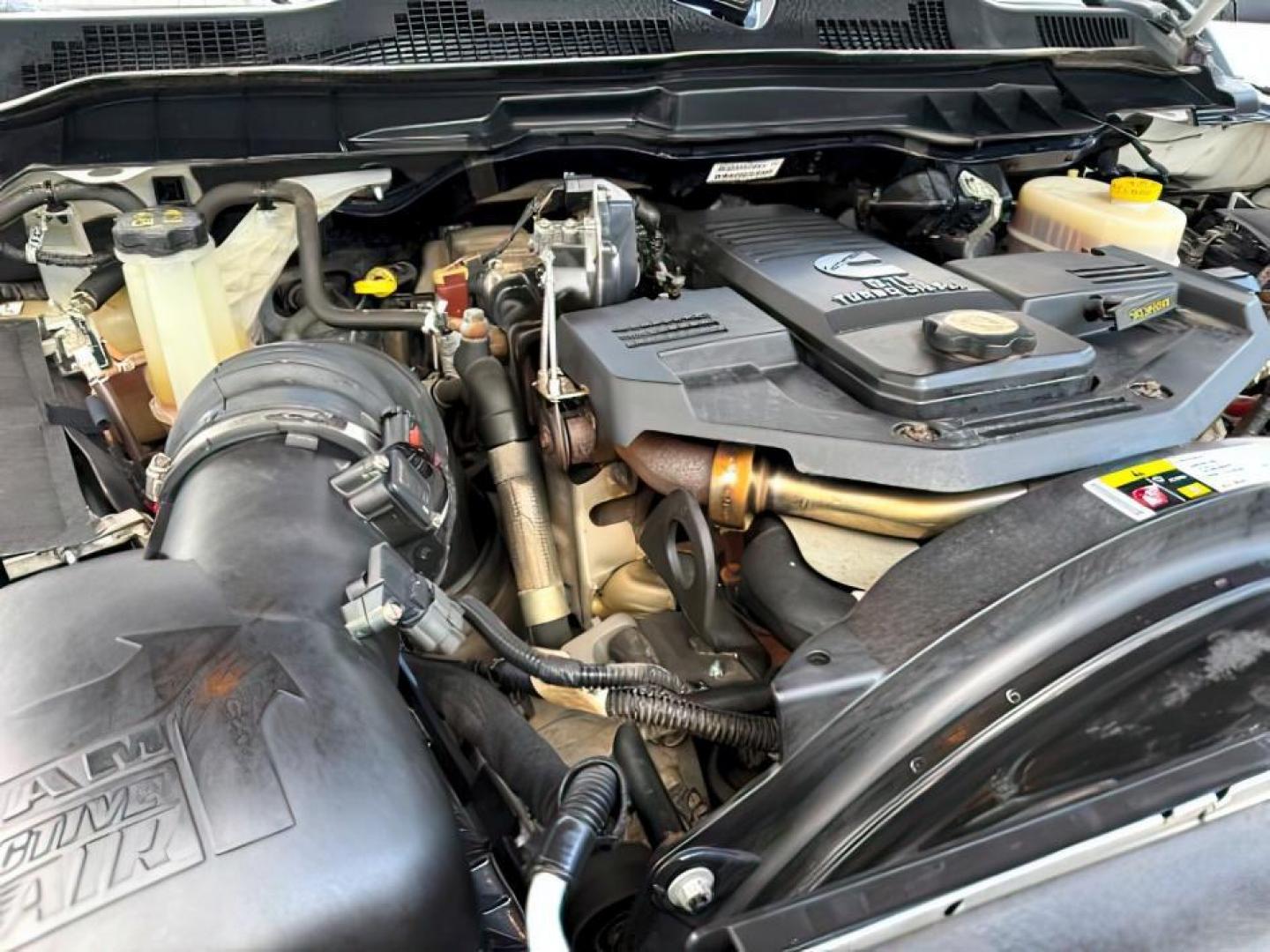 2013 Bright White Clearcoat /Light Frost Beige/Canyon Brown Ram 2500 (3C6UR5GL1DG) with an Cummins 67L I-6 diesel direct injection engine, Automatic transmission, located at 1175 N Woodruff Ave, Idaho Falls, ID, 83401, 43.506901, -111.999657 - At Timberline Auto, finding a great deal on your next vehicle is always easy! Our experienced sales staff's goal is to help find you the right vehicle at the right price! Our knowledgeable finance department has options for almost any credit score. We offer extended service contract options to prote - Photo#27