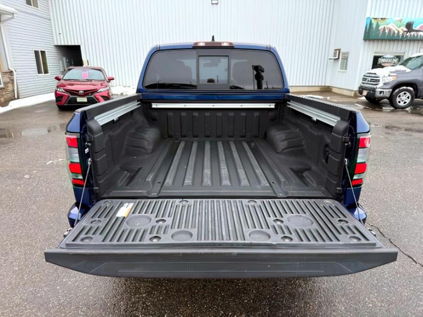 2022 Deep Blue Pearl /Charcoal Nissan Frontier (1N6ED1EK5NN) with an VQ 38L V-6 gasoline direct injection engine, Automatic transmission, located at 1175 N Woodruff Ave, Idaho Falls, ID, 83401, 43.506901, -111.999657 - At Timberline Auto, finding a great deal on your next vehicle is always easy! Our experienced sales staff's goal is to help find you the right vehicle at the right price! Our knowledgeable finance department has options for almost any credit score. We offer extended service contract options to prote - Photo#5