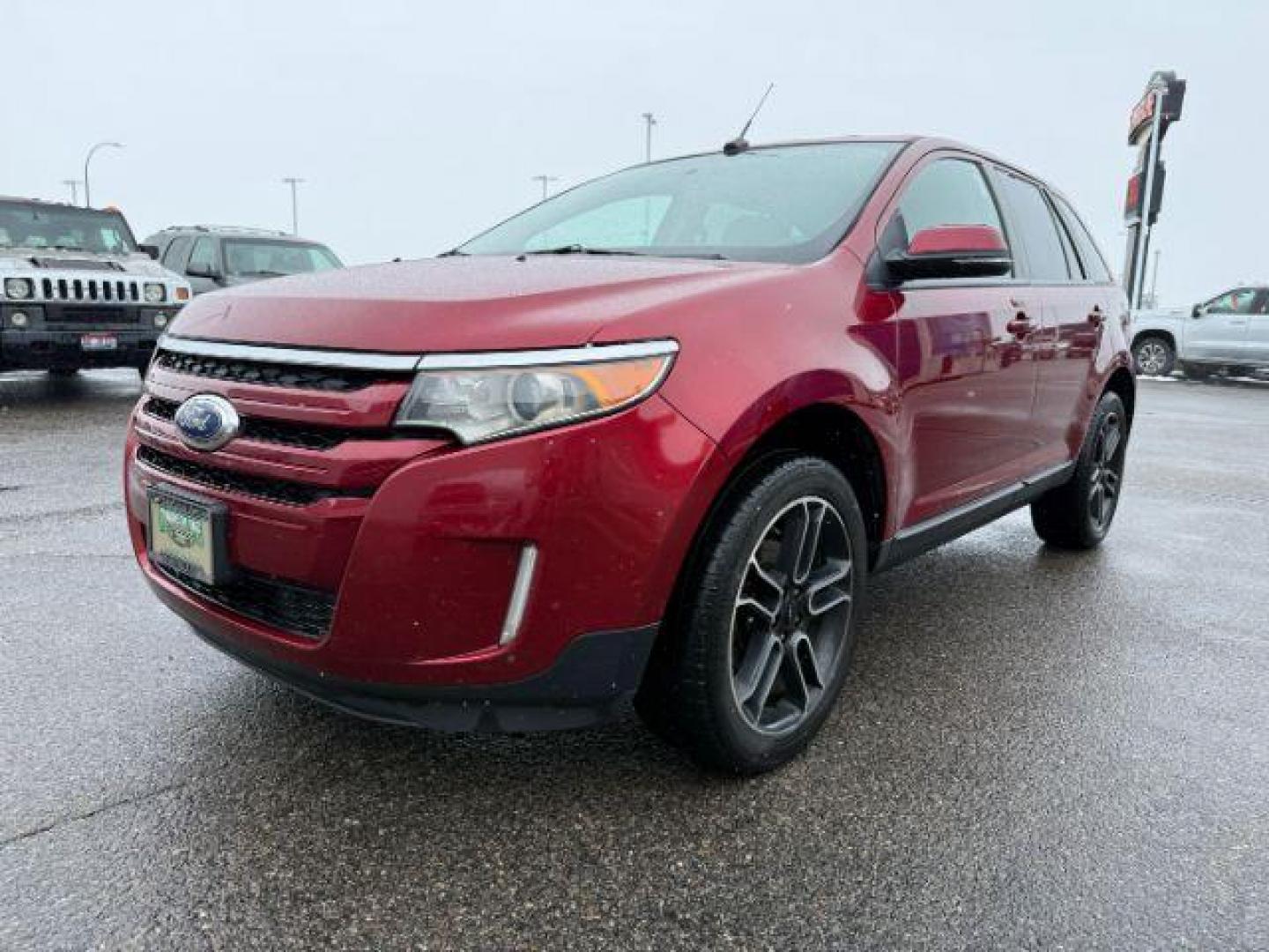 2014 Ruby Red Metallic Tinted Clearcoat /Charcoal Black Ford Edge (2FMDK4JC0EB) with an 35L V-6 DOHC engine, Automatic transmission, located at 1175 N Woodruff Ave, Idaho Falls, ID, 83401, 43.506901, -111.999657 - At Timberline Auto, finding a great deal on your next vehicle is always easy! Our experienced sales staff's goal is to help find you the right vehicle at the right price! Our knowledgeable finance department has options for almost any credit score. We offer extended service contract options to prote - Photo#0