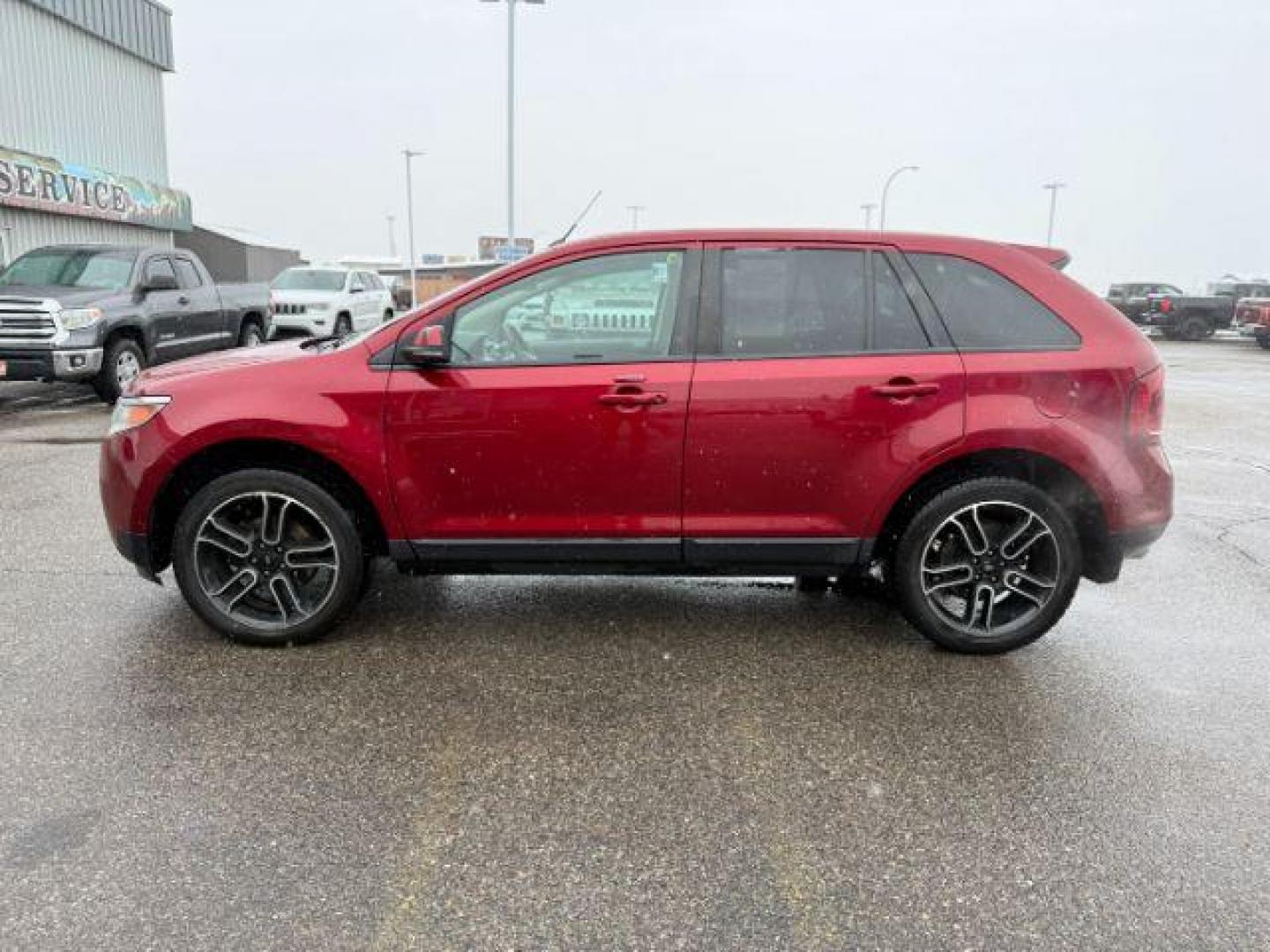 2014 Ruby Red Metallic Tinted Clearcoat /Charcoal Black Ford Edge (2FMDK4JC0EB) with an 35L V-6 DOHC engine, Automatic transmission, located at 1175 N Woodruff Ave, Idaho Falls, ID, 83401, 43.506901, -111.999657 - At Timberline Auto, finding a great deal on your next vehicle is always easy! Our experienced sales staff's goal is to help find you the right vehicle at the right price! Our knowledgeable finance department has options for almost any credit score. We offer extended service contract options to prote - Photo#1