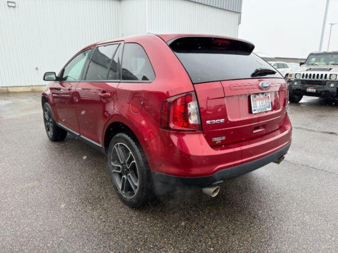 2014 Ruby Red Metallic Tinted Clearcoat /Charcoal Black Ford Edge (2FMDK4JC0EB) with an 35L V-6 DOHC engine, Automatic transmission, located at 1175 N Woodruff Ave, Idaho Falls, ID, 83401, 43.506901, -111.999657 - At Timberline Auto, finding a great deal on your next vehicle is always easy! Our experienced sales staff's goal is to help find you the right vehicle at the right price! Our knowledgeable finance department has options for almost any credit score. We offer extended service contract options to prote - Photo#2