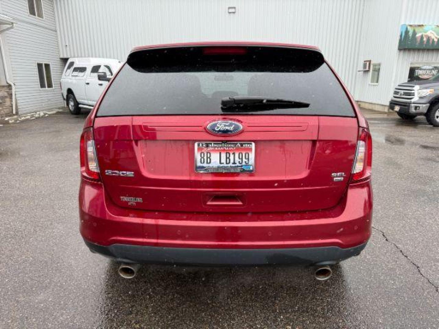 2014 Ruby Red Metallic Tinted Clearcoat /Charcoal Black Ford Edge (2FMDK4JC0EB) with an 35L V-6 DOHC engine, Automatic transmission, located at 1175 N Woodruff Ave, Idaho Falls, ID, 83401, 43.506901, -111.999657 - At Timberline Auto, finding a great deal on your next vehicle is always easy! Our experienced sales staff's goal is to help find you the right vehicle at the right price! Our knowledgeable finance department has options for almost any credit score. We offer extended service contract options to prote - Photo#3
