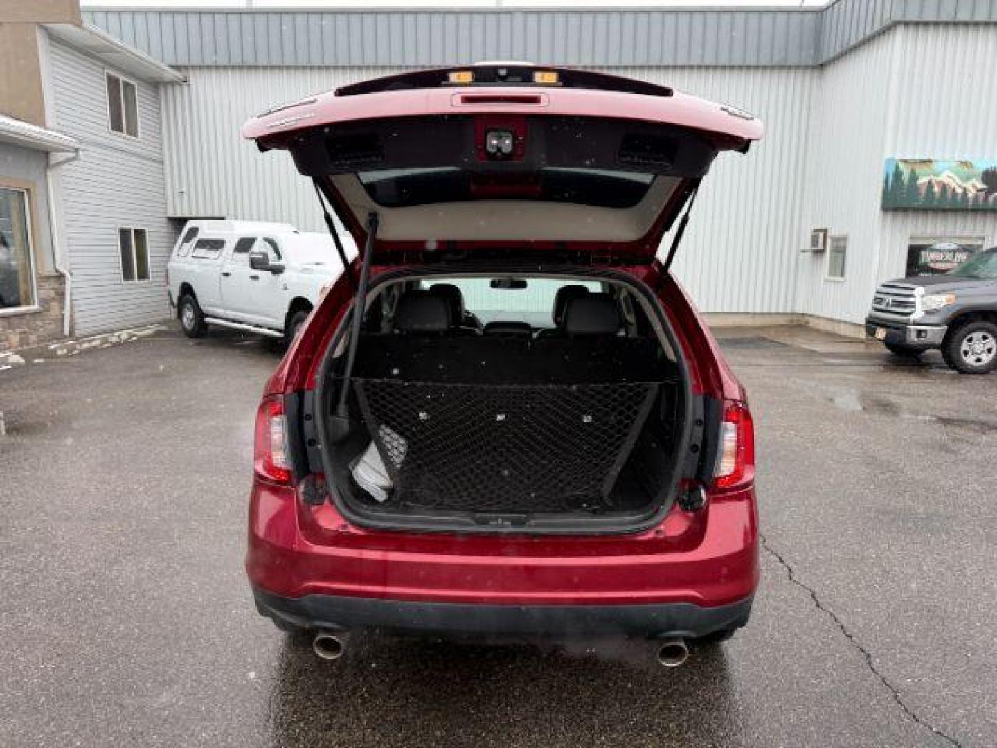2014 Ruby Red Metallic Tinted Clearcoat /Charcoal Black Ford Edge (2FMDK4JC0EB) with an 35L V-6 DOHC engine, Automatic transmission, located at 1175 N Woodruff Ave, Idaho Falls, ID, 83401, 43.506901, -111.999657 - At Timberline Auto, finding a great deal on your next vehicle is always easy! Our experienced sales staff's goal is to help find you the right vehicle at the right price! Our knowledgeable finance department has options for almost any credit score. We offer extended service contract options to prote - Photo#4