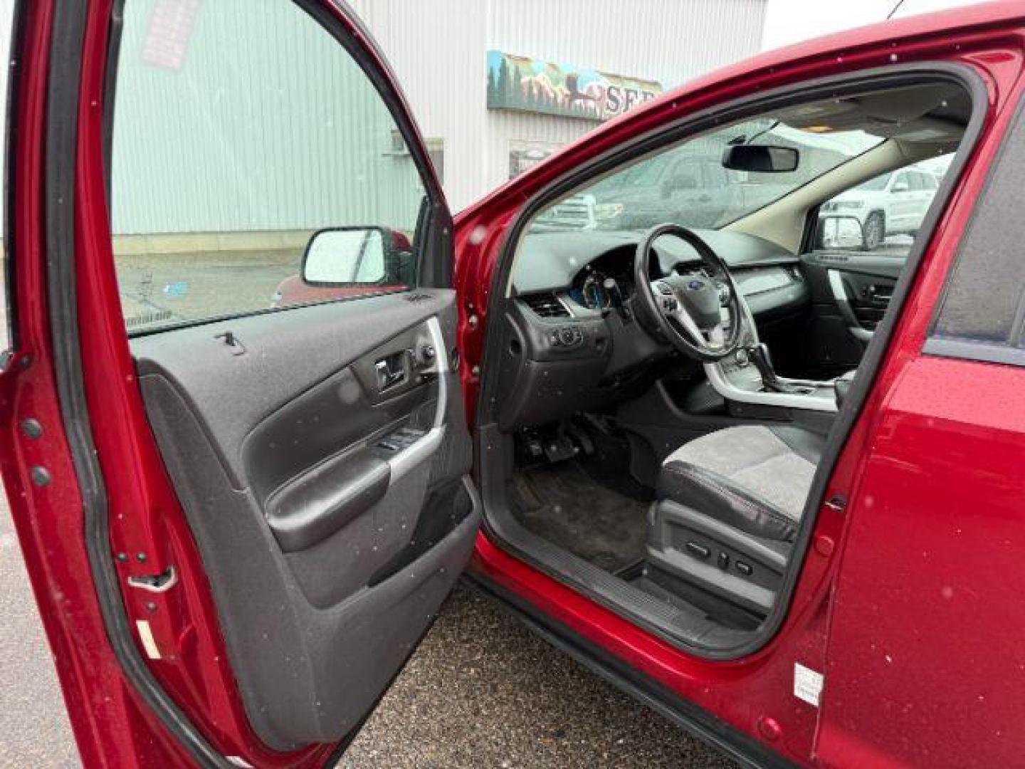2014 Ruby Red Metallic Tinted Clearcoat /Charcoal Black Ford Edge (2FMDK4JC0EB) with an 35L V-6 DOHC engine, Automatic transmission, located at 1175 N Woodruff Ave, Idaho Falls, ID, 83401, 43.506901, -111.999657 - At Timberline Auto, finding a great deal on your next vehicle is always easy! Our experienced sales staff's goal is to help find you the right vehicle at the right price! Our knowledgeable finance department has options for almost any credit score. We offer extended service contract options to prote - Photo#12