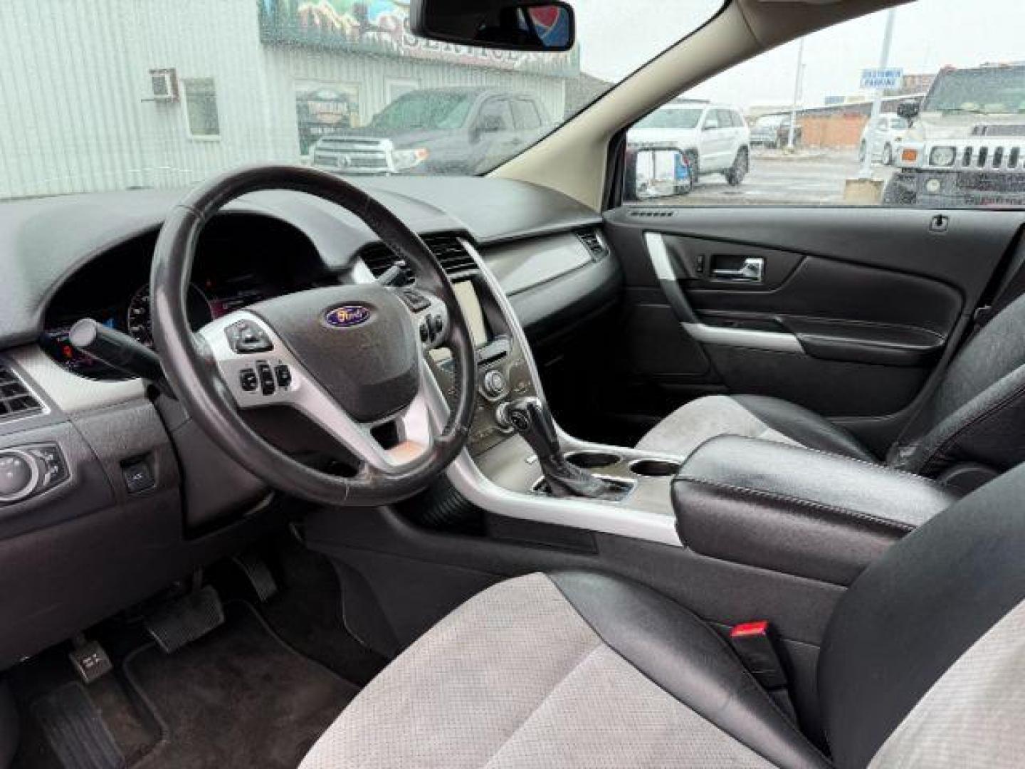 2014 Ruby Red Metallic Tinted Clearcoat /Charcoal Black Ford Edge (2FMDK4JC0EB) with an 35L V-6 DOHC engine, Automatic transmission, located at 1175 N Woodruff Ave, Idaho Falls, ID, 83401, 43.506901, -111.999657 - At Timberline Auto, finding a great deal on your next vehicle is always easy! Our experienced sales staff's goal is to help find you the right vehicle at the right price! Our knowledgeable finance department has options for almost any credit score. We offer extended service contract options to prote - Photo#14