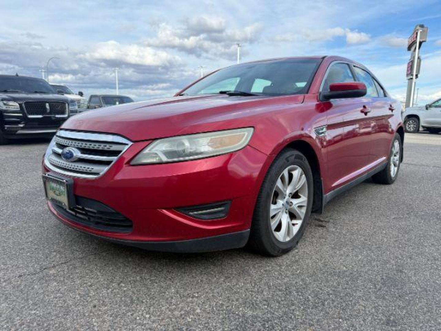 2011 RED /Charcoal Black Ford Taurus (1FAHP2HW3BG) with an Duratec 35L V-6 DOHC engine, Automatic transmission, located at 1175 N Woodruff Ave, Idaho Falls, ID, 83401, 43.506901, -111.999657 - At Timberline Auto, finding a great deal on your next vehicle is always easy! Our experienced sales staff's goal is to help find you the right vehicle at the right price! Our knowledgeable finance department has options for almost any credit score. We offer extended service contract options to prote - Photo#0