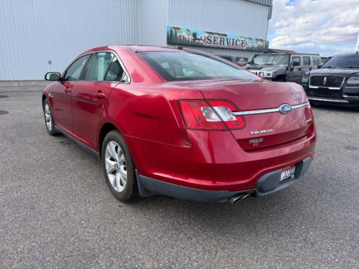 2011 RED /Charcoal Black Ford Taurus (1FAHP2HW3BG) with an Duratec 35L V-6 DOHC engine, Automatic transmission, located at 1175 N Woodruff Ave, Idaho Falls, ID, 83401, 43.506901, -111.999657 - At Timberline Auto, finding a great deal on your next vehicle is always easy! Our experienced sales staff's goal is to help find you the right vehicle at the right price! Our knowledgeable finance department has options for almost any credit score. We offer extended service contract options to prote - Photo#2