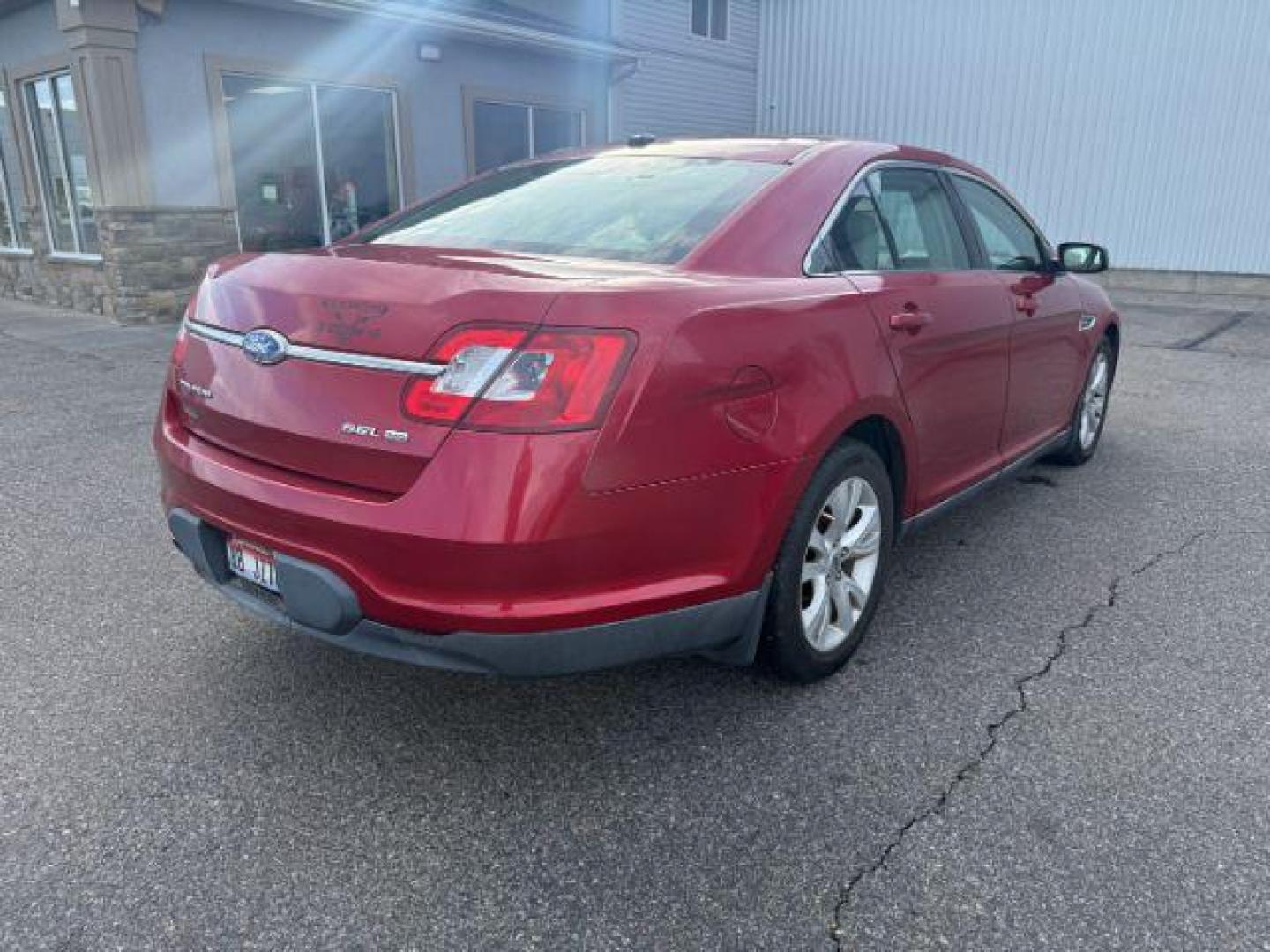 2011 RED /Charcoal Black Ford Taurus (1FAHP2HW3BG) with an Duratec 35L V-6 DOHC engine, Automatic transmission, located at 1175 N Woodruff Ave, Idaho Falls, ID, 83401, 43.506901, -111.999657 - At Timberline Auto, finding a great deal on your next vehicle is always easy! Our experienced sales staff's goal is to help find you the right vehicle at the right price! Our knowledgeable finance department has options for almost any credit score. We offer extended service contract options to prote - Photo#3
