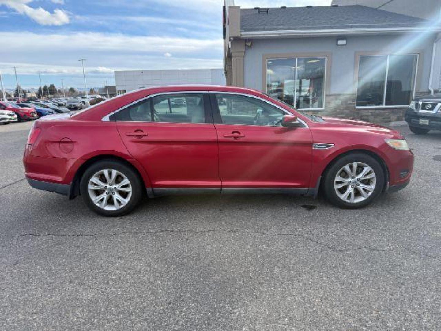 2011 RED /Charcoal Black Ford Taurus (1FAHP2HW3BG) with an Duratec 35L V-6 DOHC engine, Automatic transmission, located at 1175 N Woodruff Ave, Idaho Falls, ID, 83401, 43.506901, -111.999657 - At Timberline Auto, finding a great deal on your next vehicle is always easy! Our experienced sales staff's goal is to help find you the right vehicle at the right price! Our knowledgeable finance department has options for almost any credit score. We offer extended service contract options to prote - Photo#4