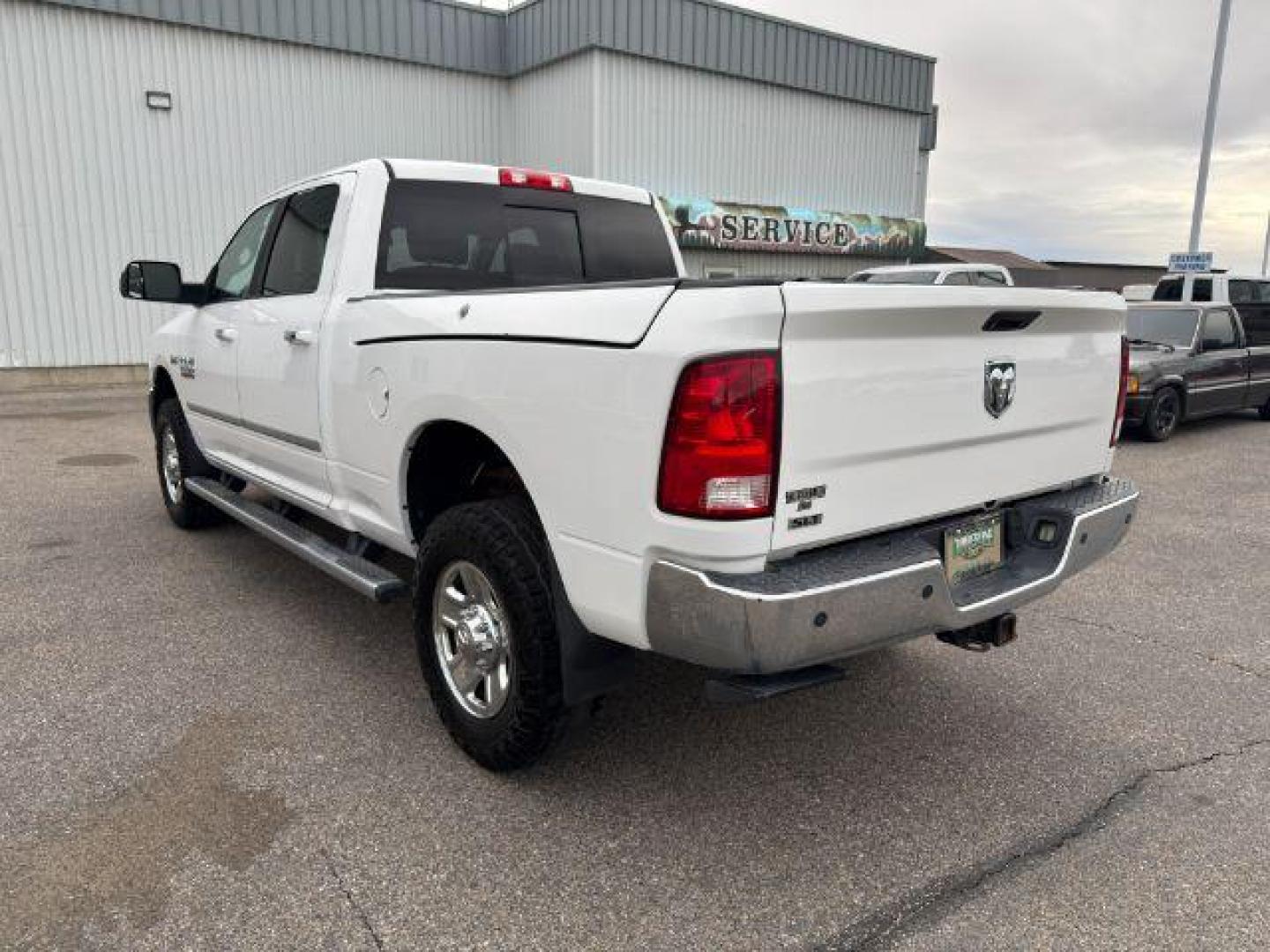 2015 Bright White Clearcoat /Diesel Gray/Black Ram 2500 SLT (3C6UR5DJ5FG) with an HEMI 6.4L V-8 VVT variable valve control engine, AUTOMATIC transmission, located at 1235 N Woodruff Ave., Idaho Falls, 83401, (208) 523-1053, 43.507172, -112.000488 - At Timberline Auto, finding a great deal on your next vehicle is always easy! Our experienced sales staff's goal is to help find you the right vehicle at the right price! Our knowledgeable finance department has options for almost any credit score. We offer extended service contract options to prote - Photo#25