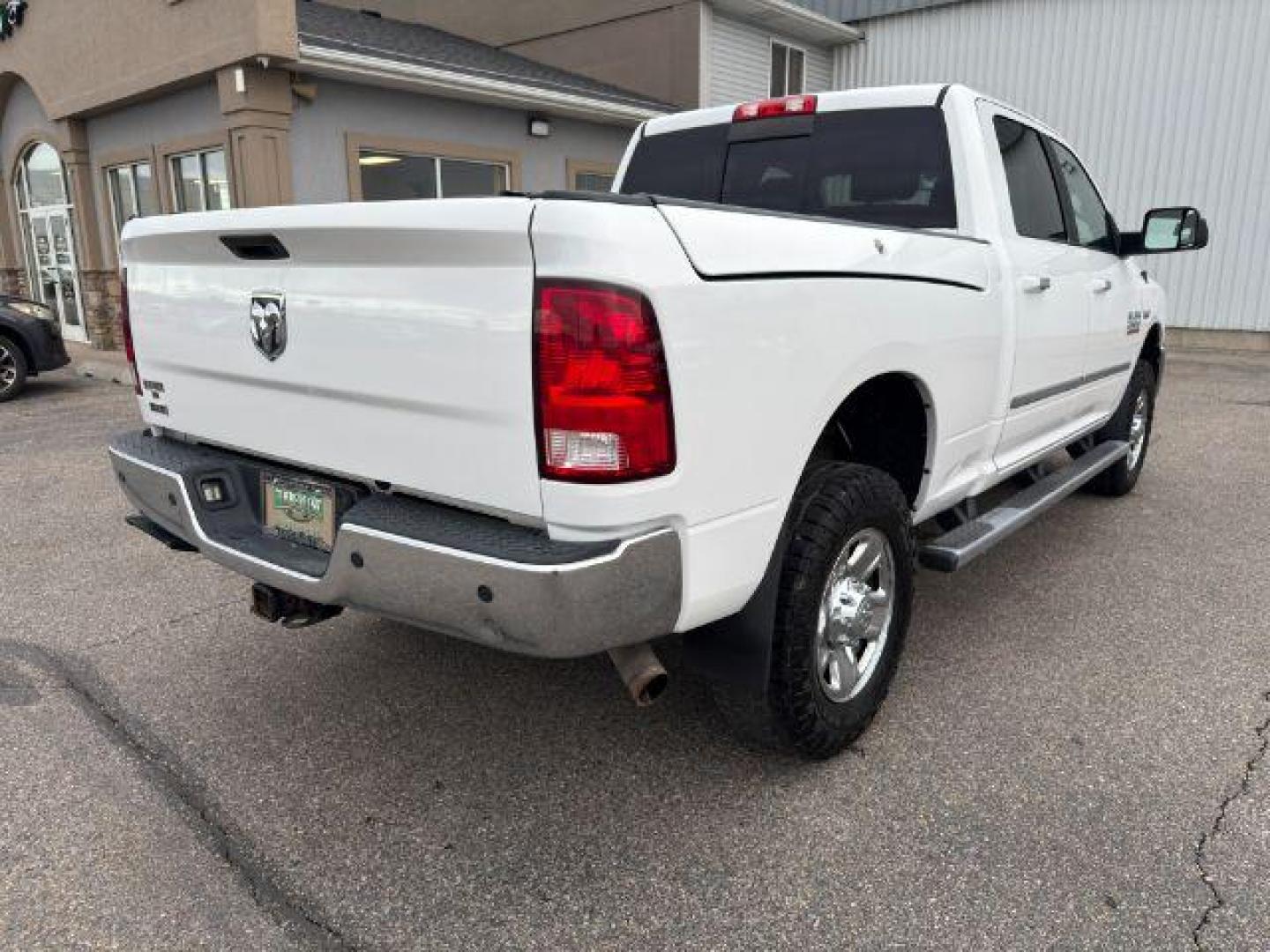 2015 Bright White Clearcoat /Diesel Gray/Black Ram 2500 SLT (3C6UR5DJ5FG) with an HEMI 6.4L V-8 VVT variable valve control engine, AUTOMATIC transmission, located at 1235 N Woodruff Ave., Idaho Falls, 83401, (208) 523-1053, 43.507172, -112.000488 - At Timberline Auto, finding a great deal on your next vehicle is always easy! Our experienced sales staff's goal is to help find you the right vehicle at the right price! Our knowledgeable finance department has options for almost any credit score. We offer extended service contract options to prote - Photo#28