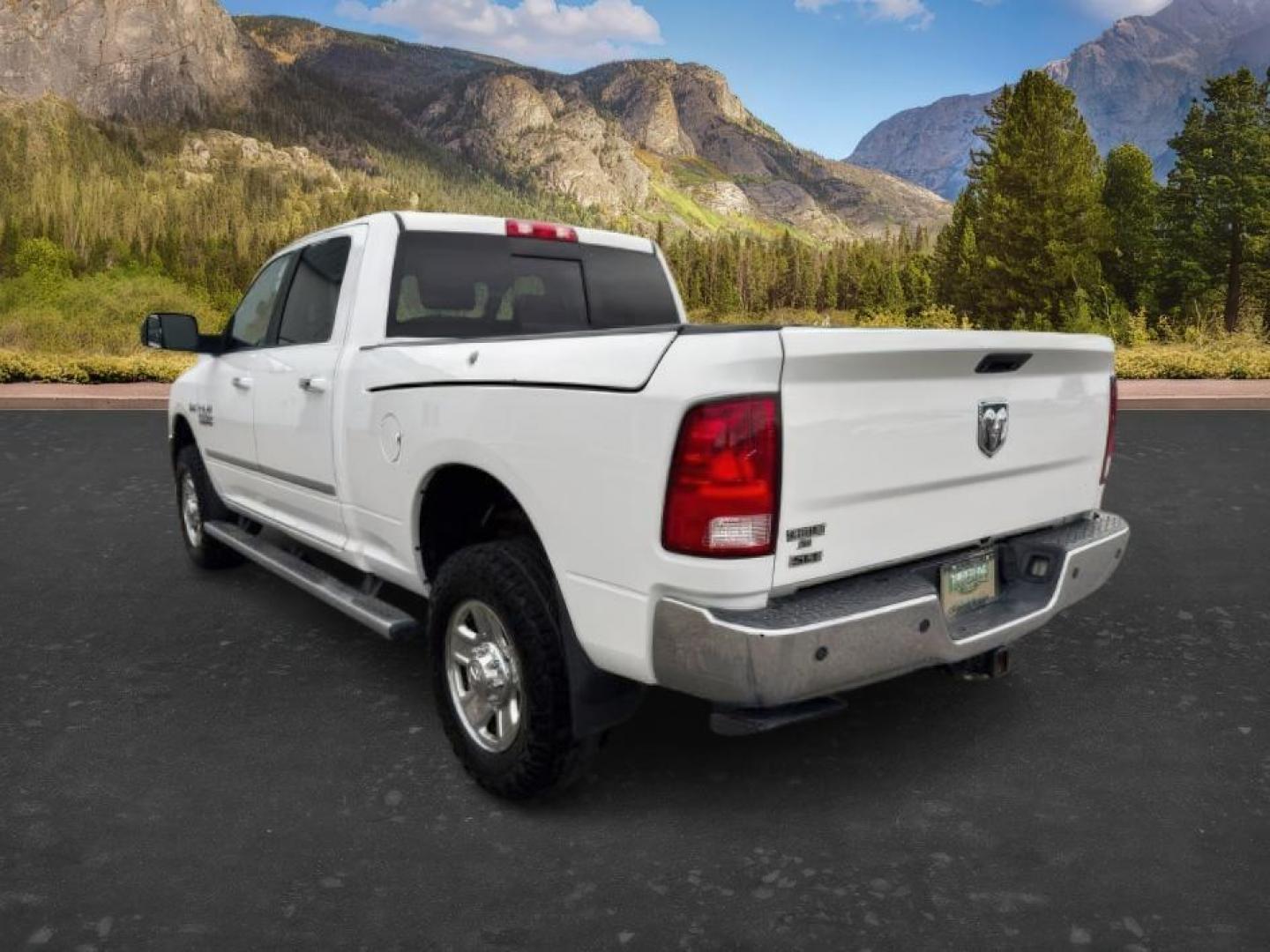 2015 Bright White Clearcoat /Diesel Gray/Black Ram 2500 SLT (3C6UR5DJ5FG) with an HEMI 6.4L V-8 VVT variable valve control engine, AUTOMATIC transmission, located at 1235 N Woodruff Ave., Idaho Falls, 83401, (208) 523-1053, 43.507172, -112.000488 - At Timberline Auto, finding a great deal on your next vehicle is always easy! Our experienced sales staff's goal is to help find you the right vehicle at the right price! Our knowledgeable finance department has options for almost any credit score. We offer extended service contract options to prote - Photo#2