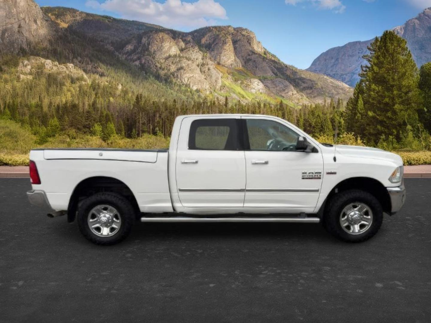 2015 Bright White Clearcoat /Diesel Gray/Black Ram 2500 SLT (3C6UR5DJ5FG) with an HEMI 6.4L V-8 VVT variable valve control engine, AUTOMATIC transmission, located at 1235 N Woodruff Ave., Idaho Falls, 83401, (208) 523-1053, 43.507172, -112.000488 - At Timberline Auto, finding a great deal on your next vehicle is always easy! Our experienced sales staff's goal is to help find you the right vehicle at the right price! Our knowledgeable finance department has options for almost any credit score. We offer extended service contract options to prote - Photo#6