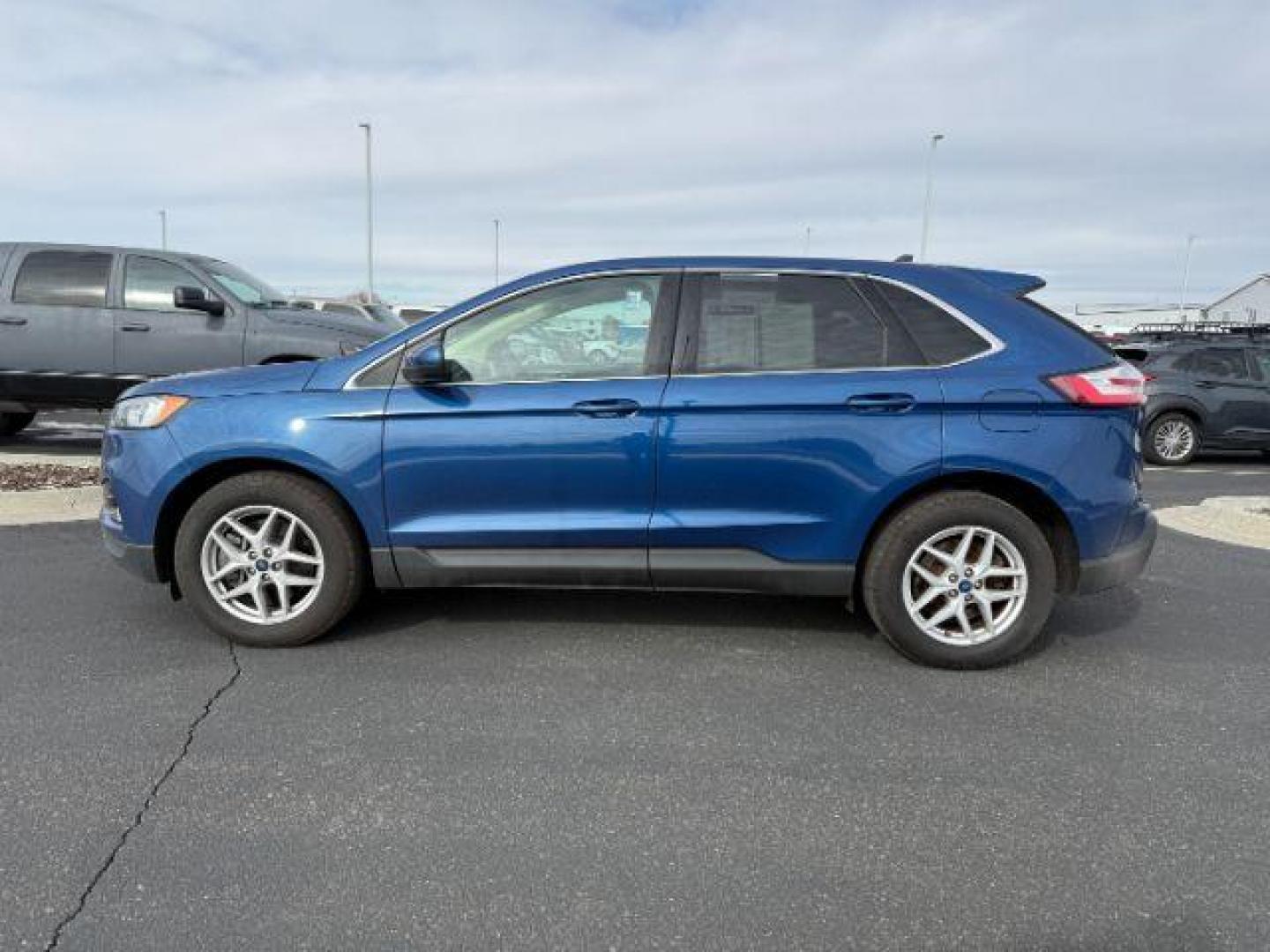 2021 BLUE /Ebony Ford Edge (2FMPK4J91MB) with an EcoBoost 2L I-4 gasoline direct injection engine, Automatic transmission, located at 1175 N Woodruff Ave, Idaho Falls, ID, 83401, 43.506901, -111.999657 - At Timberline Auto, finding a great deal on your next vehicle is always easy! Our experienced sales staff's goal is to help find you the right vehicle at the right price! Our knowledgeable finance department has options for almost any credit score. We offer extended service contract options to prote - Photo#1