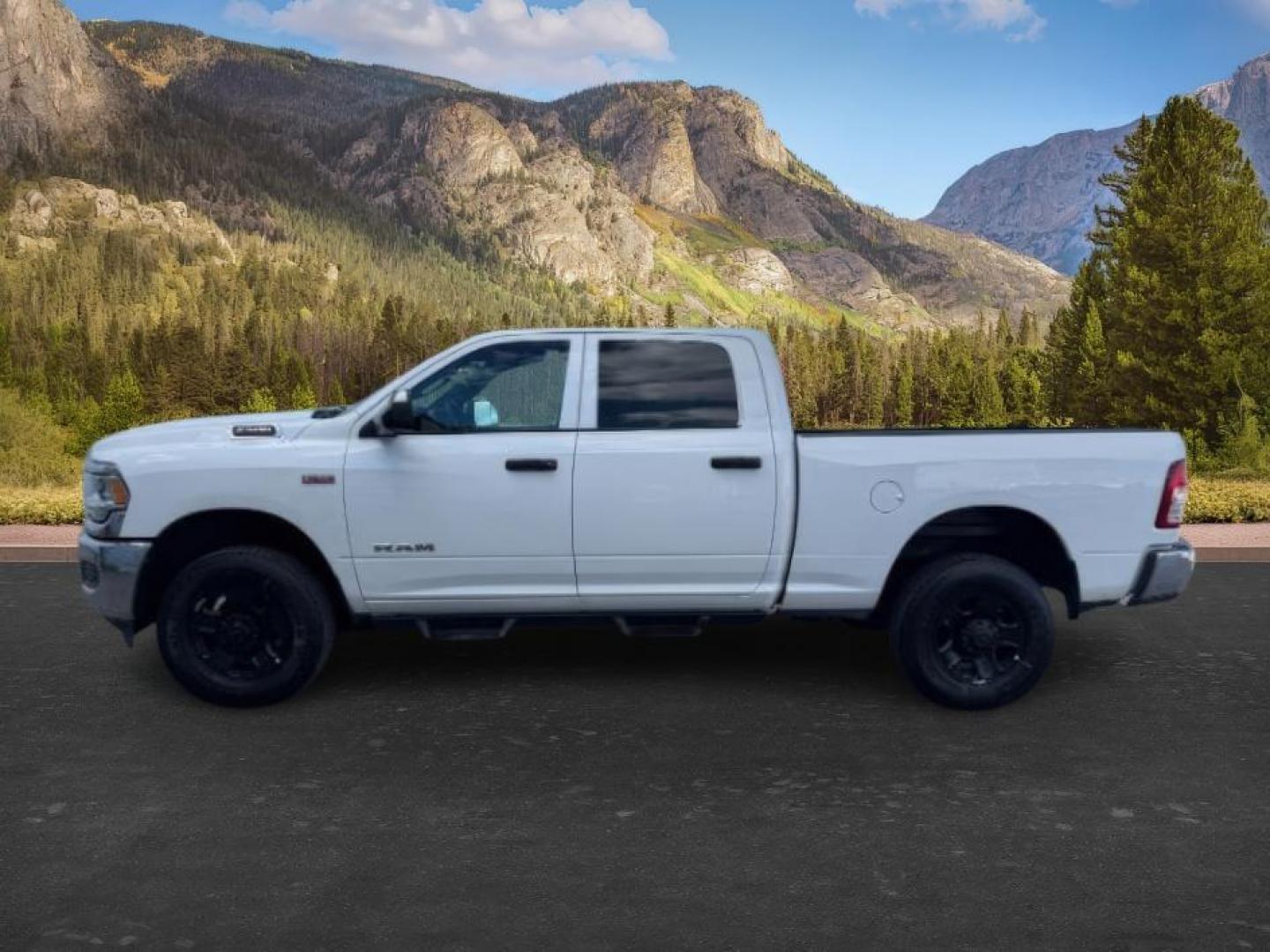 2021 WHITE /Diesel Gray/Black Ram 2500 (3C6UR5CJ0MG) with an HEMI 64L V-8 VVT variable valve control engine, Automatic transmission, located at 1175 N Woodruff Ave, Idaho Falls, ID, 83401, 43.506901, -111.999657 - At Timberline Auto, finding a great deal on your next vehicle is always easy! Our experienced sales staff's goal is to help find you the right vehicle at the right price! Our knowledgeable finance department has options for almost any credit score. We offer extended service contract options to prote - Photo#1