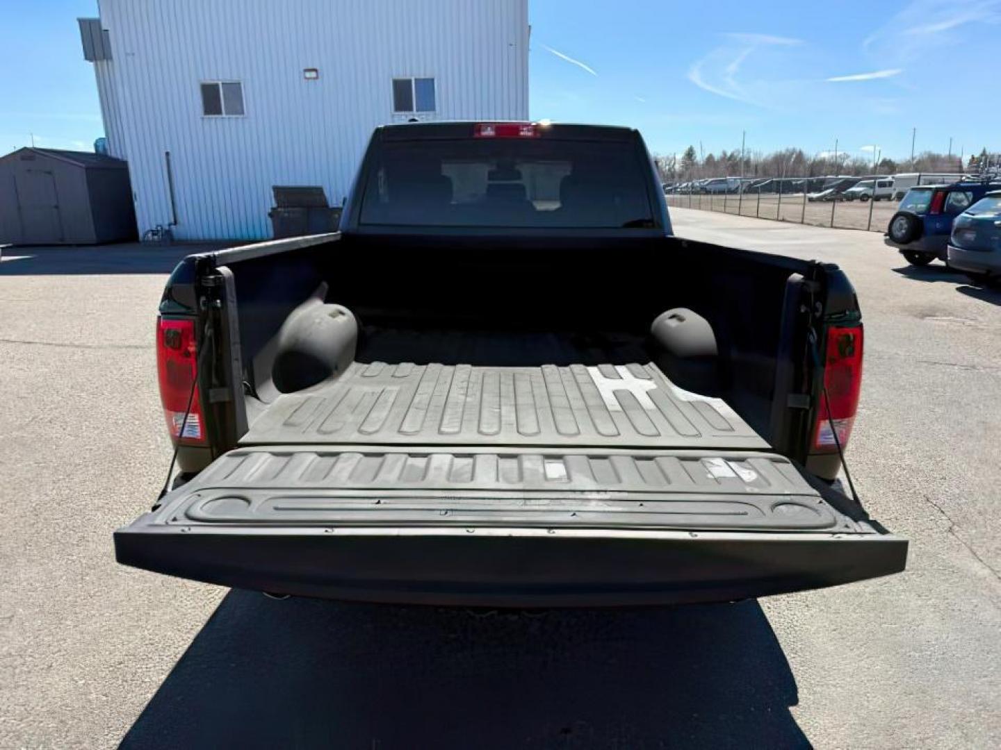 2014 Black Clearcoat /Diesel Gray/Black Ram 1500 (1C6RR7FT9ES) with an HEMI 57L V-8 variable valve control engine, Automatic transmission, located at 1175 N Woodruff Ave, Idaho Falls, ID, 83401, 43.506901, -111.999657 - At Timberline Auto, finding a great deal on your next vehicle is always easy! Our experienced sales staff's goal is to help find you the right vehicle at the right price! Our knowledgeable finance department has options for almost any credit score. We offer extended service contract options to prote - Photo#3