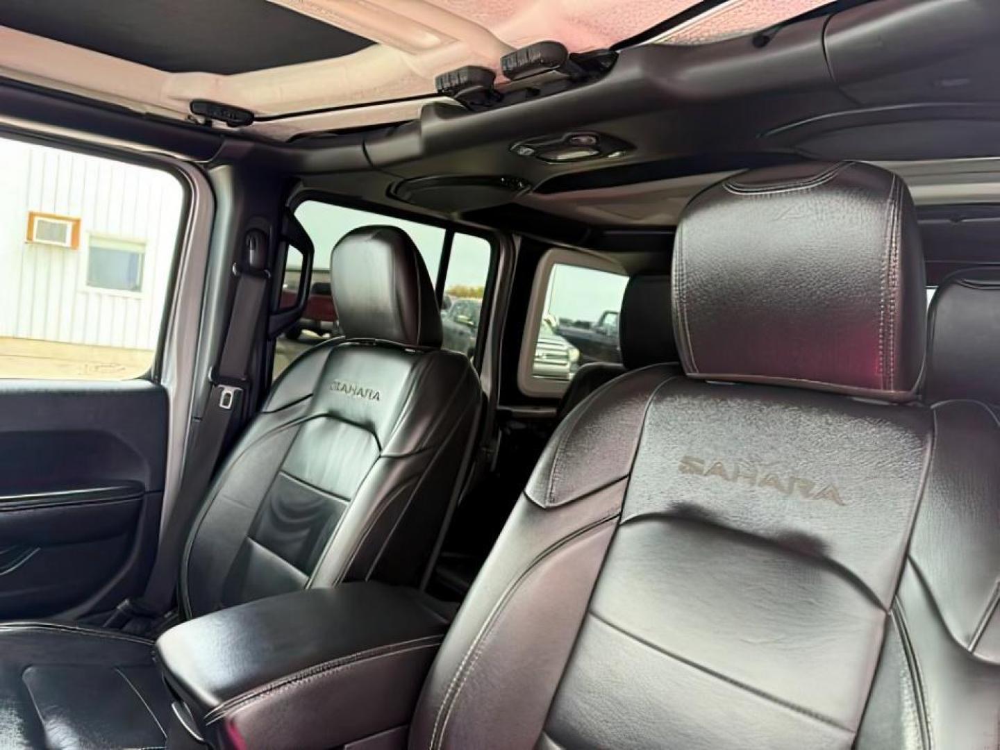 2018 SILVER /Black/Black Jeep Wrangler Unlimited Sahara (1C4HJXEN7JW) with an 2L I-4 gasoline direct injection engine, AUTOMATIC transmission, located at 1235 N Woodruff Ave., Idaho Falls, 83401, (208) 523-1053, 43.507172, -112.000488 - At Timberline Auto, finding a great deal on your next vehicle is always easy! Our experienced sales staff's goal is to help find you the right vehicle at the right price! Our knowledgeable finance department has options for almost any credit score. We offer extended service contract options to prote - Photo#21
