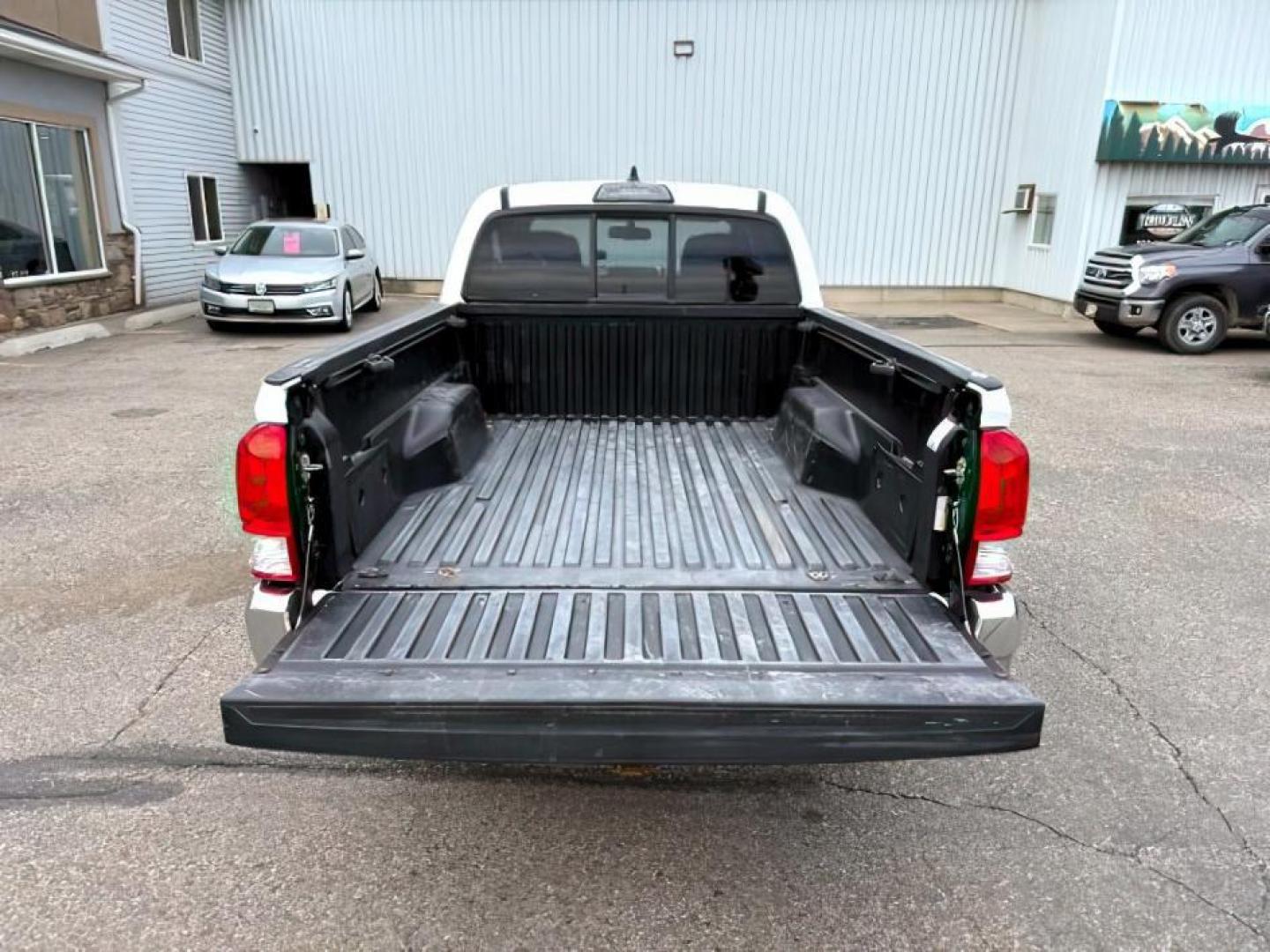 2016 Super White /Black/Red Toyota Tacoma (3TMDZ5BN8GM) with an 35L V-6 portdirect injection engine, Automatic transmission, located at 1175 N Woodruff Ave, Idaho Falls, ID, 83401, 43.506901, -111.999657 - At Timberline Auto, finding a great deal on your next vehicle is always easy! Our experienced sales staff's goal is to help find you the right vehicle at the right price! Our knowledgeable finance department has options for almost any credit score. We offer extended service contract options to prote - Photo#5