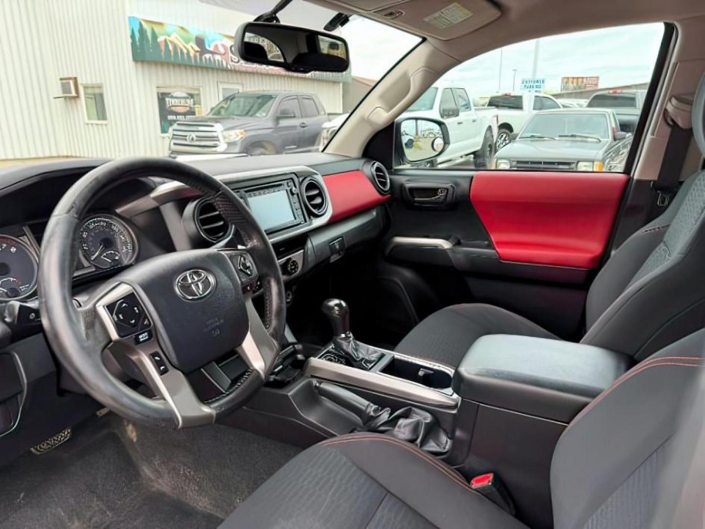 2016 Super White /Black/Red Toyota Tacoma (3TMDZ5BN8GM) with an 35L V-6 portdirect injection engine, Automatic transmission, located at 1175 N Woodruff Ave, Idaho Falls, ID, 83401, 43.506901, -111.999657 - At Timberline Auto, finding a great deal on your next vehicle is always easy! Our experienced sales staff's goal is to help find you the right vehicle at the right price! Our knowledgeable finance department has options for almost any credit score. We offer extended service contract options to prote - Photo#13
