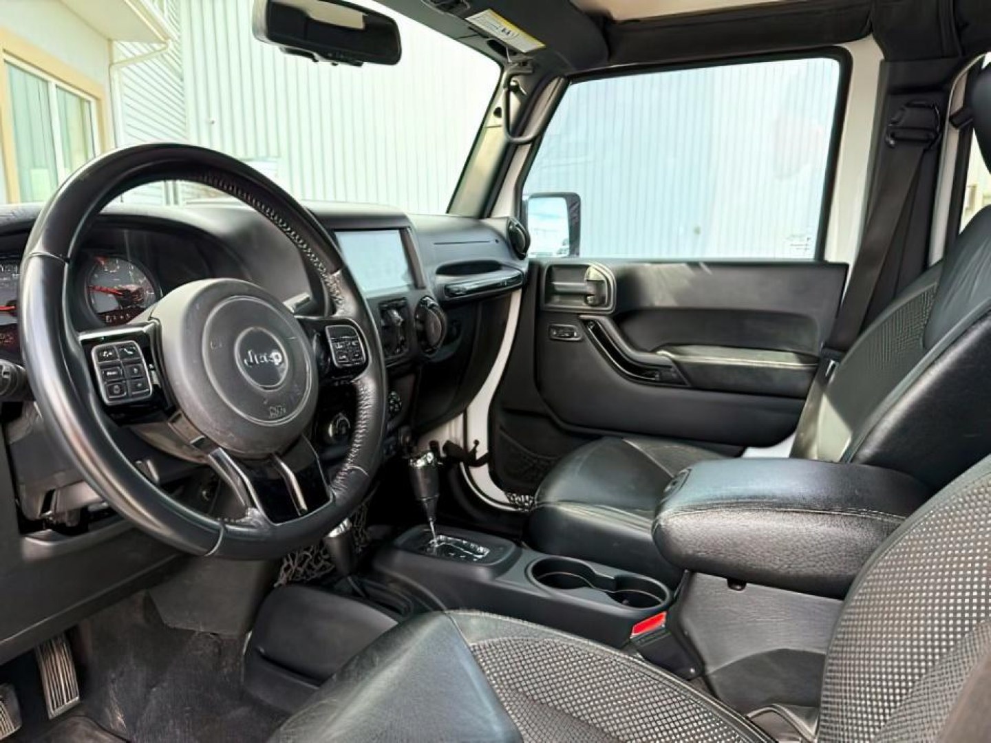 2016 WHITE /Black Jeep Wrangler Unlimited (1C4BJWEG5GL) with an Pentastar 36L V-6 DOHC engine, Automatic transmission, located at 1175 N Woodruff Ave, Idaho Falls, ID, 83401, 43.506901, -111.999657 - At Timberline Auto, finding a great deal on your next vehicle is always easy! Our experienced sales staff's goal is to help find you the right vehicle at the right price! Our knowledgeable finance department has options for almost any credit score. We offer extended service contract options to prote - Photo#14