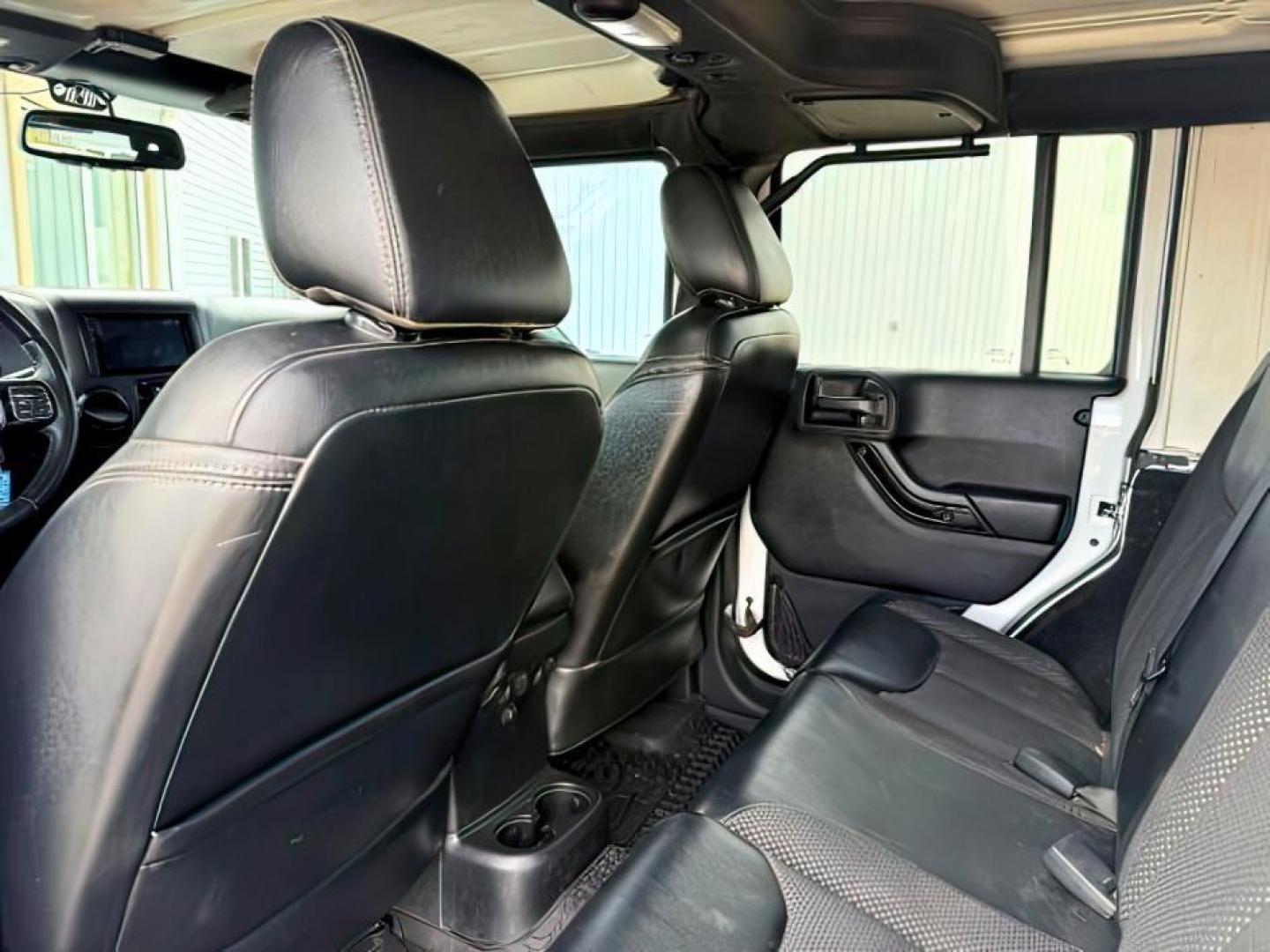 2016 WHITE /Black Jeep Wrangler Unlimited (1C4BJWEG5GL) with an Pentastar 36L V-6 DOHC engine, Automatic transmission, located at 1175 N Woodruff Ave, Idaho Falls, ID, 83401, 43.506901, -111.999657 - At Timberline Auto, finding a great deal on your next vehicle is always easy! Our experienced sales staff's goal is to help find you the right vehicle at the right price! Our knowledgeable finance department has options for almost any credit score. We offer extended service contract options to prote - Photo#21