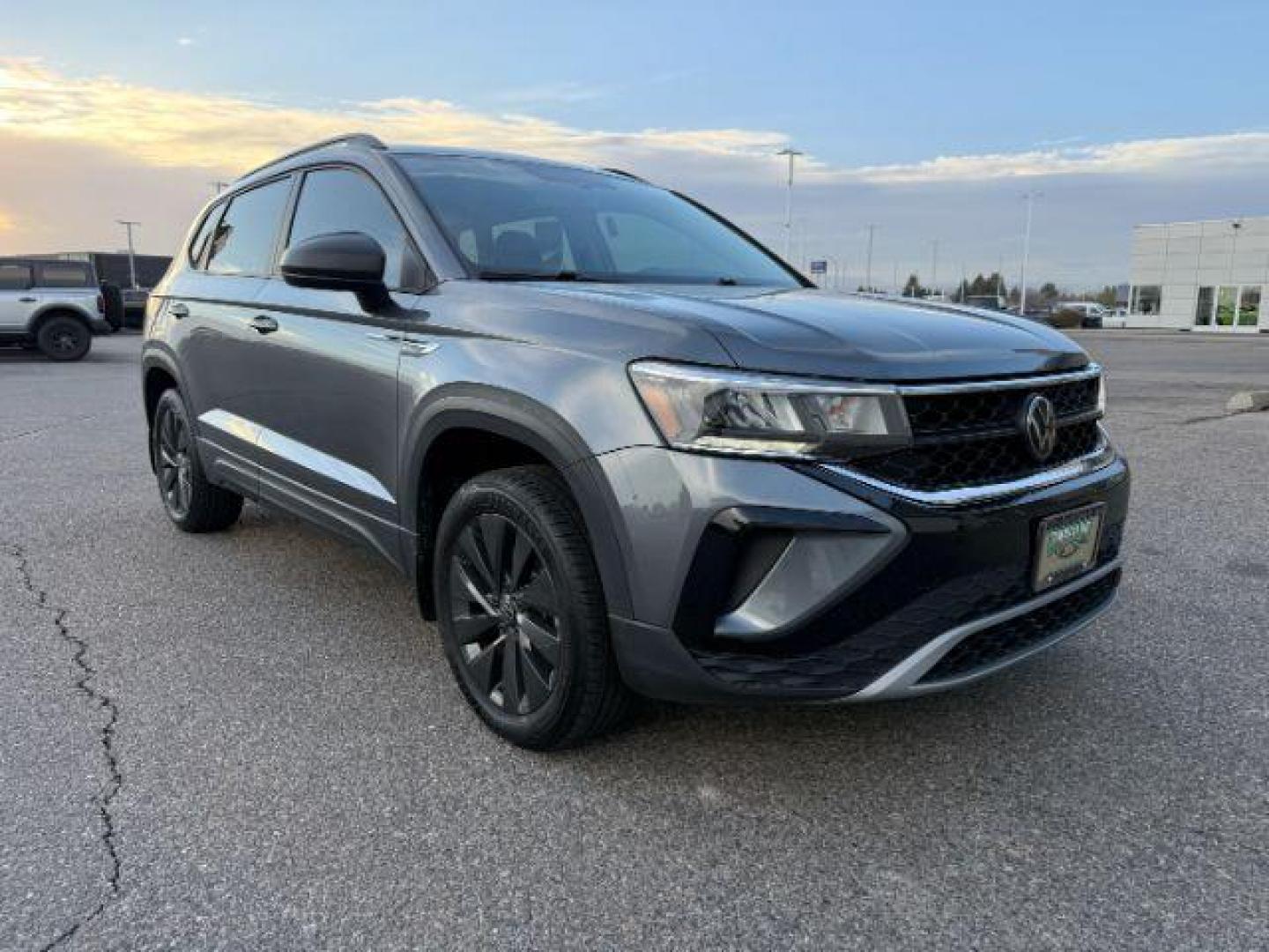 2023 GRAY /Gray/Black Volkswagen Taos (3VVCX7B23PM) with an 15L I-4 gasoline direct injection engine, Automatic transmission, located at 1175 N Woodruff Ave, Idaho Falls, ID, 83401, 43.506901, -111.999657 - At Timberline Auto, finding a great deal on your next vehicle is always easy! Our experienced sales staff's goal is to help find you the right vehicle at the right price! Our knowledgeable finance department has options for almost any credit score. We offer extended service contract options to prote - Photo#34