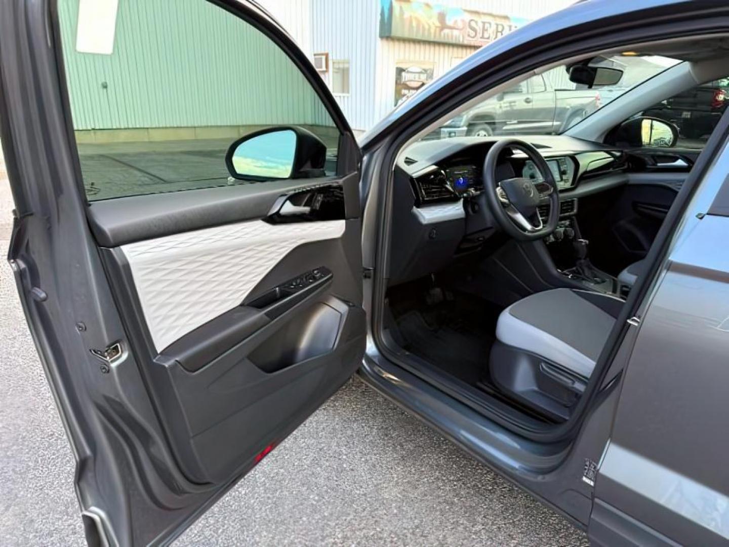 2023 GRAY /Gray/Black Volkswagen Taos (3VVCX7B23PM) with an 15L I-4 gasoline direct injection engine, Automatic transmission, located at 1175 N Woodruff Ave, Idaho Falls, ID, 83401, 43.506901, -111.999657 - At Timberline Auto, finding a great deal on your next vehicle is always easy! Our experienced sales staff's goal is to help find you the right vehicle at the right price! Our knowledgeable finance department has options for almost any credit score. We offer extended service contract options to prote - Photo#13