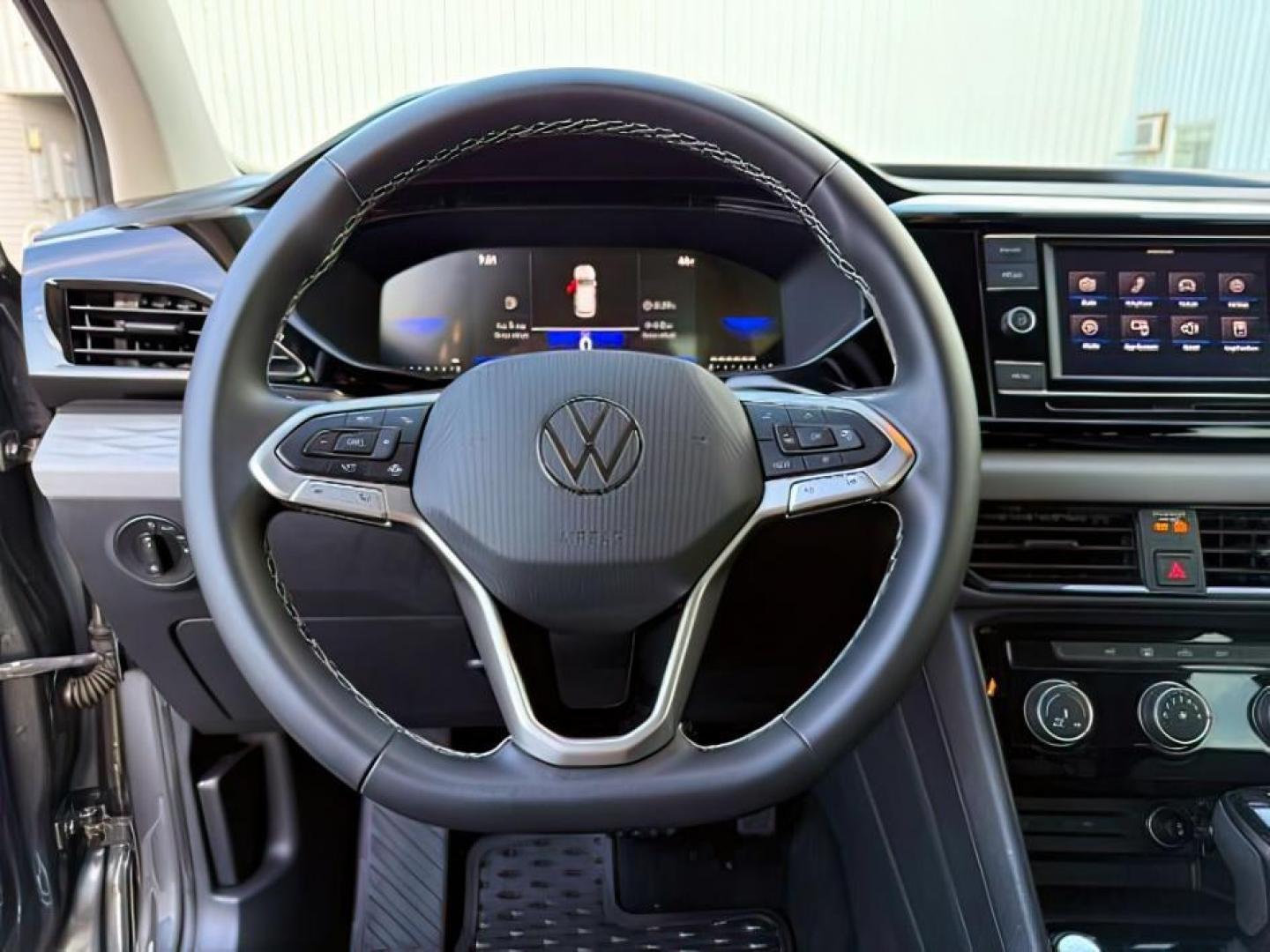 2023 GRAY /Gray/Black Volkswagen Taos (3VVCX7B23PM) with an 15L I-4 gasoline direct injection engine, Automatic transmission, located at 1175 N Woodruff Ave, Idaho Falls, ID, 83401, 43.506901, -111.999657 - At Timberline Auto, finding a great deal on your next vehicle is always easy! Our experienced sales staff's goal is to help find you the right vehicle at the right price! Our knowledgeable finance department has options for almost any credit score. We offer extended service contract options to prote - Photo#16