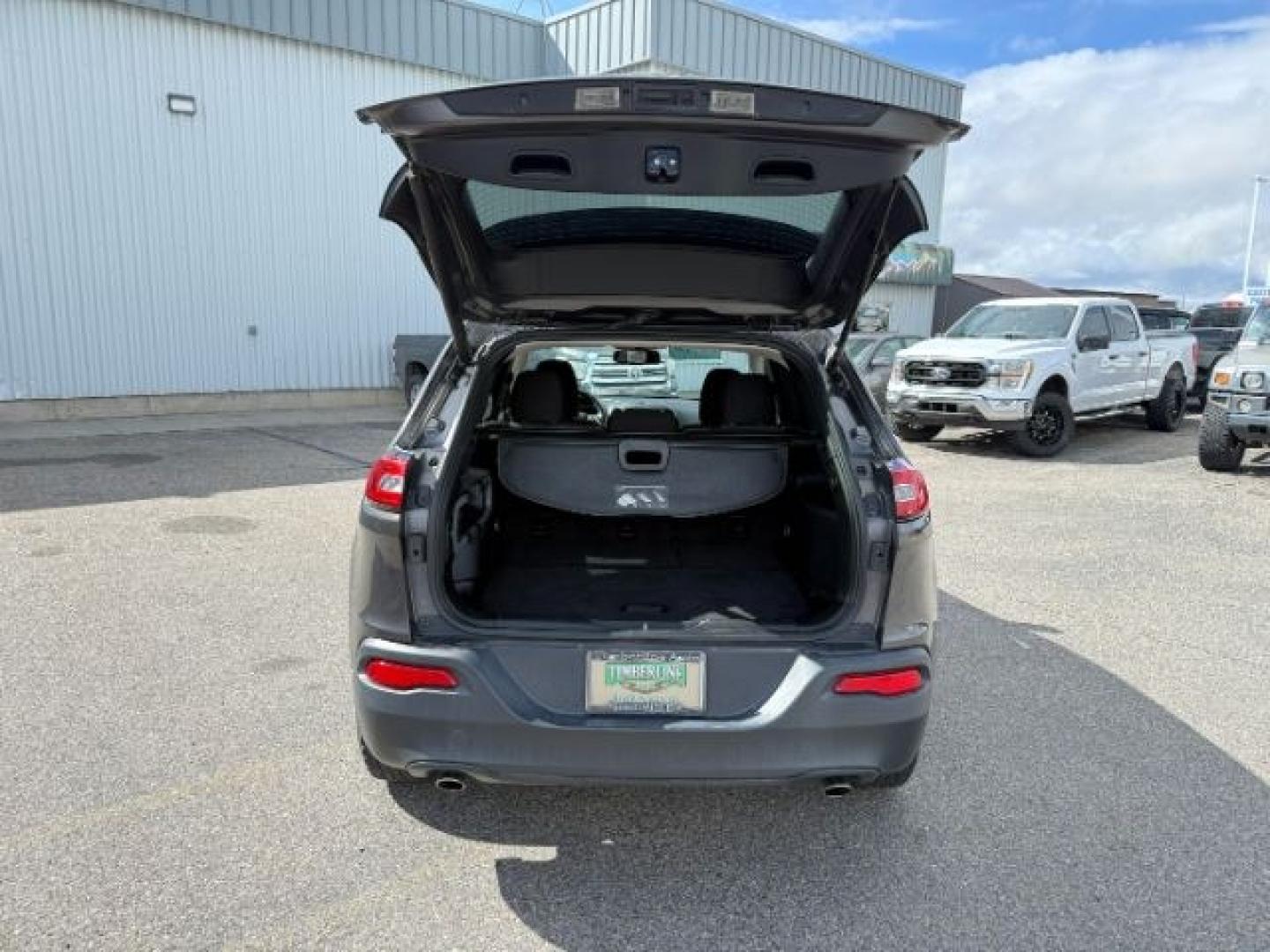 2014 GRAY /Black Jeep Cherokee (1C4PJMCSXEW) with an 32L V-6 DOHC engine, Automatic transmission, located at 1175 N Woodruff Ave, Idaho Falls, ID, 83401, 43.506901, -111.999657 - At Timberline Auto, finding a great deal on your next vehicle is always easy! Our experienced sales staff's goal is to help find you the right vehicle at the right price! Our knowledgeable finance department has options for almost any credit score. We offer extended service contract options to prote - Photo#32