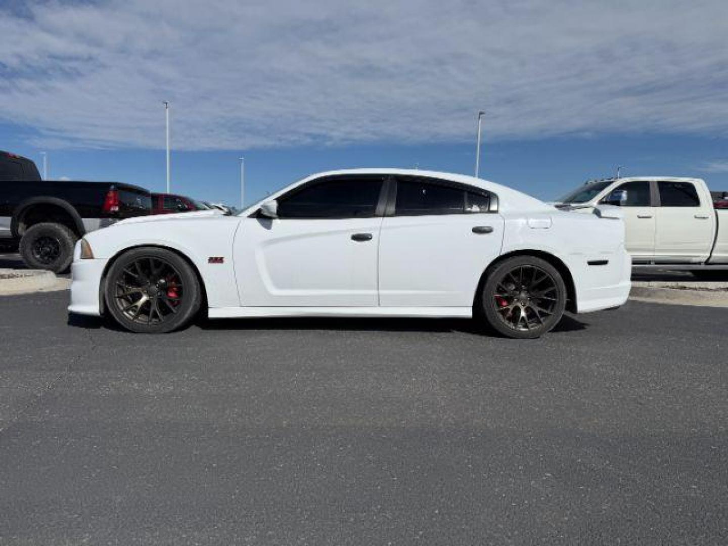 2012 Bright White Clearcoat /Black Dodge Charger (2C3CDXEJ9CH) with an HEMI 64L V-8 premium unleaded engine, Automatic transmission, located at 1175 N Woodruff Ave, Idaho Falls, ID, 83401, 43.506901, -111.999657 - At Timberline Auto, finding a great deal on your next vehicle is always easy! Our experienced sales staff's goal is to help find you the right vehicle at the right price! Our knowledgeable finance department has options for almost any credit score. We offer extended service contract options to prote - Photo#1